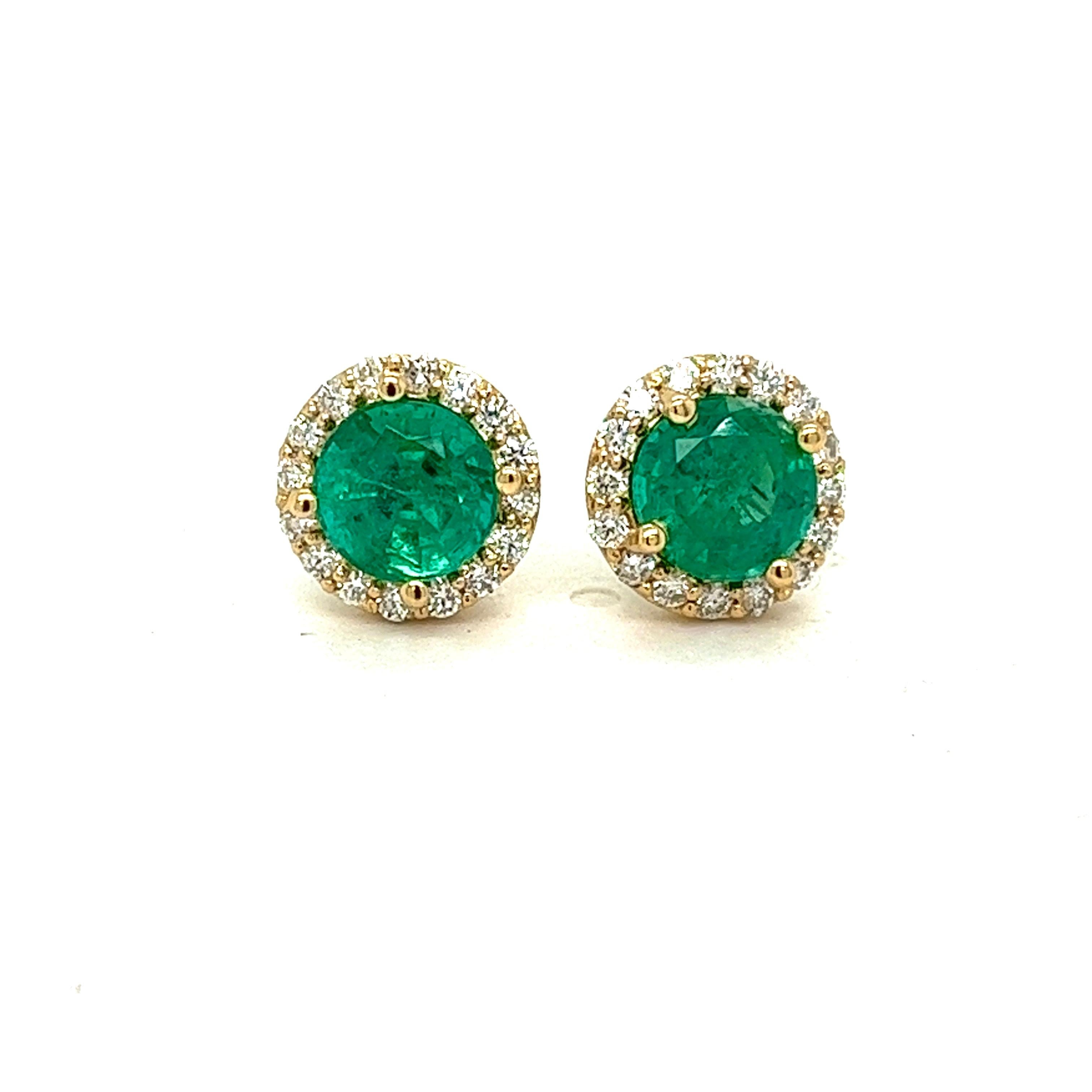 Experience sheer opulence with our exquisite Natural Green Emerald Halo Earrings. 
This captivating pair showcases two 7mm round emeralds, totaling an impressive 2.84 carats. with Zambian Providence.
Emeralds have natural inclusions, which are not