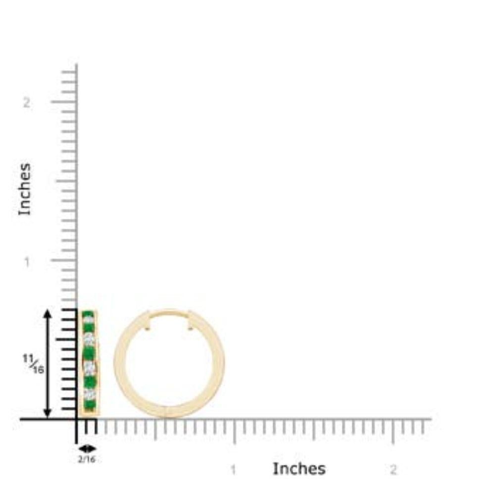 Combining the sparkle of white diamonds and the rich green hue of emeralds, this pair of hoop earrings make a stunning accessory. The diamonds and emeralds are channel set in an alternating pattern. Crafted in 14k yellow gold, these emerald earrings