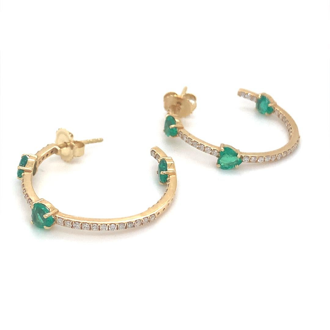 Natural 1.48 Carat emerald and 0.65 carat diamond hoop earring is set in 18 kt yellow gold. 