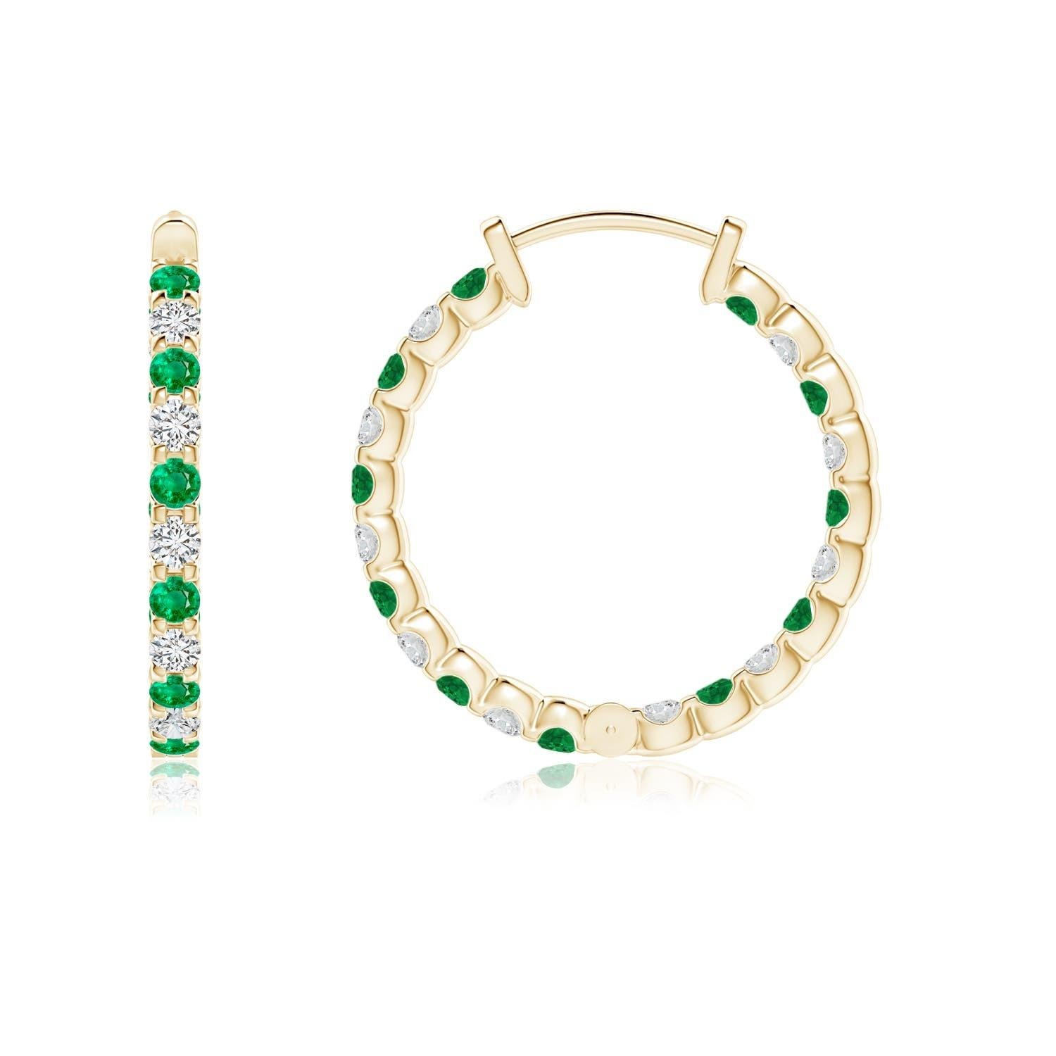 Alternately secured in prong settings are lush green emeralds and brilliant diamonds on these stunning hoop earrings. The scintillating gems are embellished on the outside as well as the inside of these 14k yellow gold hoops, showcasing a striking