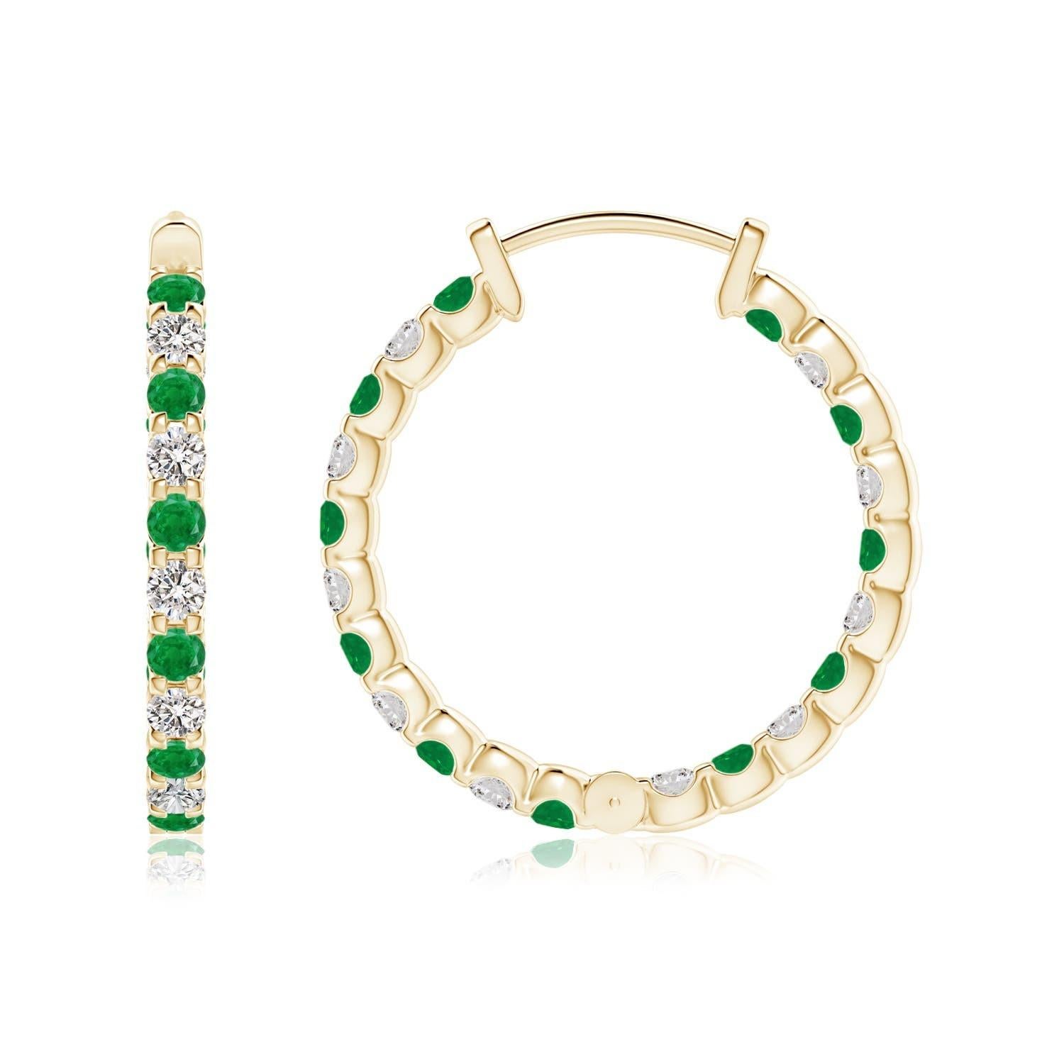 Alternately secured in prong settings are lush green emeralds and brilliant diamonds on these stunning hoop earrings. The scintillating gems are embellished on the outside as well as the inside of these 14k yellow gold hoops, showcasing a striking