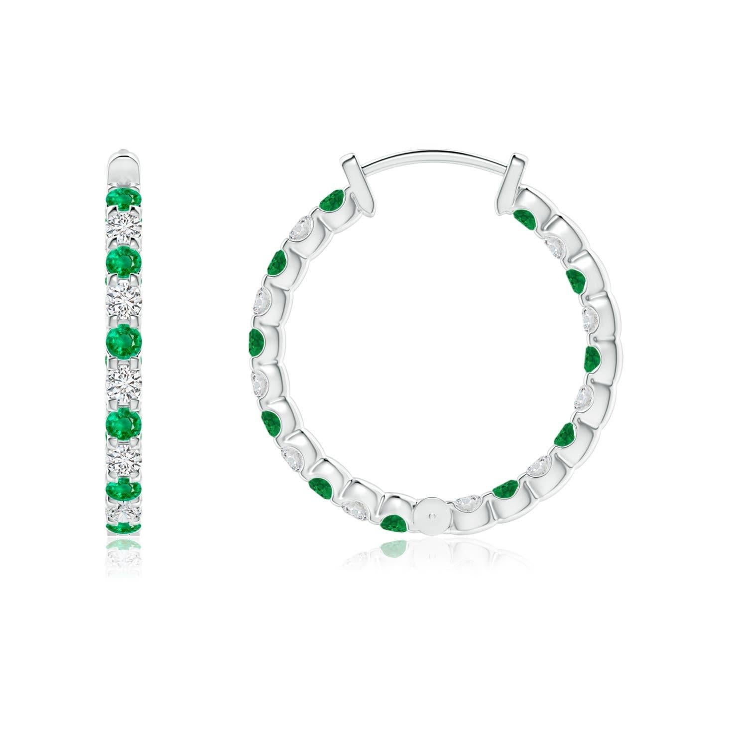 Alternately secured in prong settings are lush green emeralds and brilliant diamonds on these stunning hoop earrings. The scintillating gems are embellished on the outside as well as the inside of these platinum hoops, showcasing a striking contrast