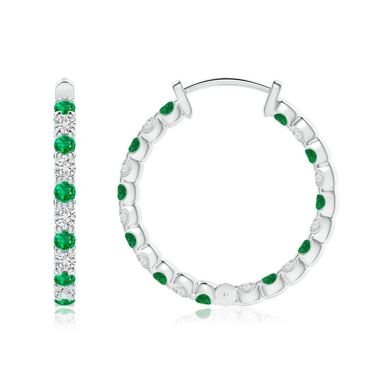 Alternately secured in prong settings are lush green emeralds and brilliant diamonds on these stunning hoop earrings. The scintillating gems are embellished on the outside as well as the inside of these platinum hoops, showcasing a striking contrast
