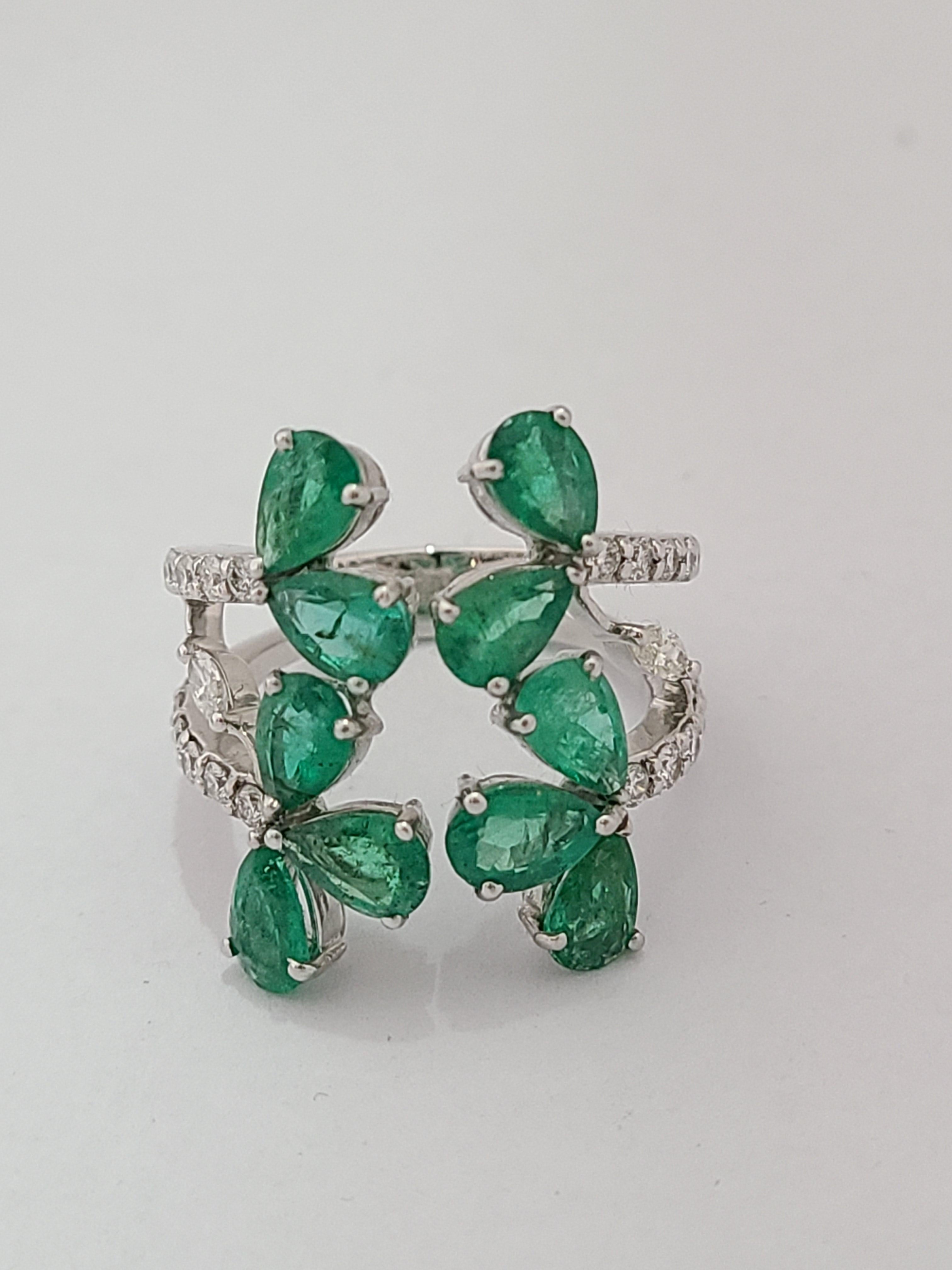 A chic and modern emerald and diamond ring set in 18k white gold. The natural emerald weight is 3.40 carats and natural diamond combined weight is .58 carats. The Ring dimensions in cm 2.10 x 1.40 x 2.20 (LXWXH). Ring size US 6.