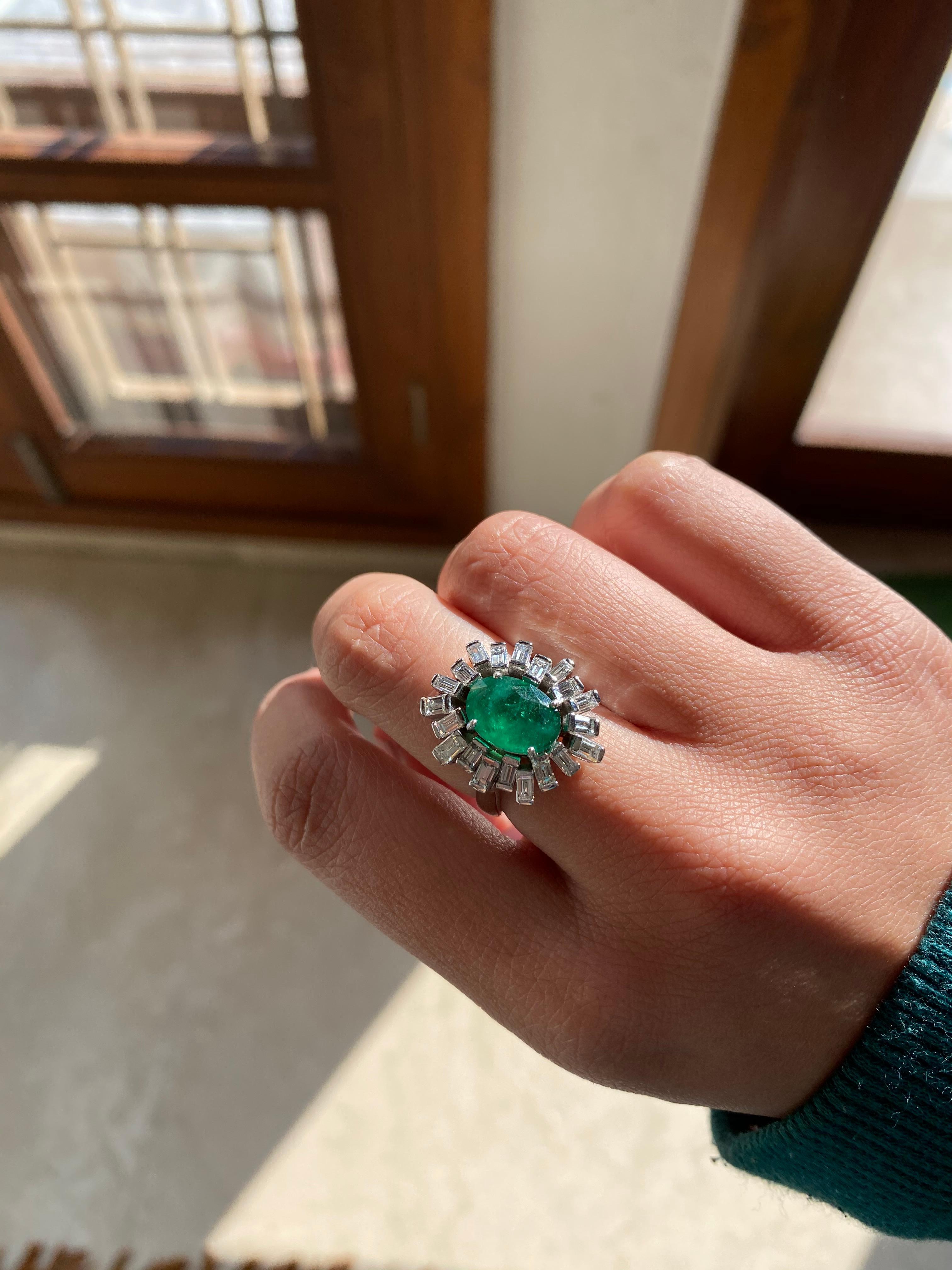 A beautiful and chic emerald and diamond ring set in 18k white gold . The natural emerald weight is 2.54 carats , diamond weight is 1.52 carats , net gold weight is 7.865 grams. The ring dimensions in cm 1.5 x 1.2 x 2.1 (LXWXH). US size 6.