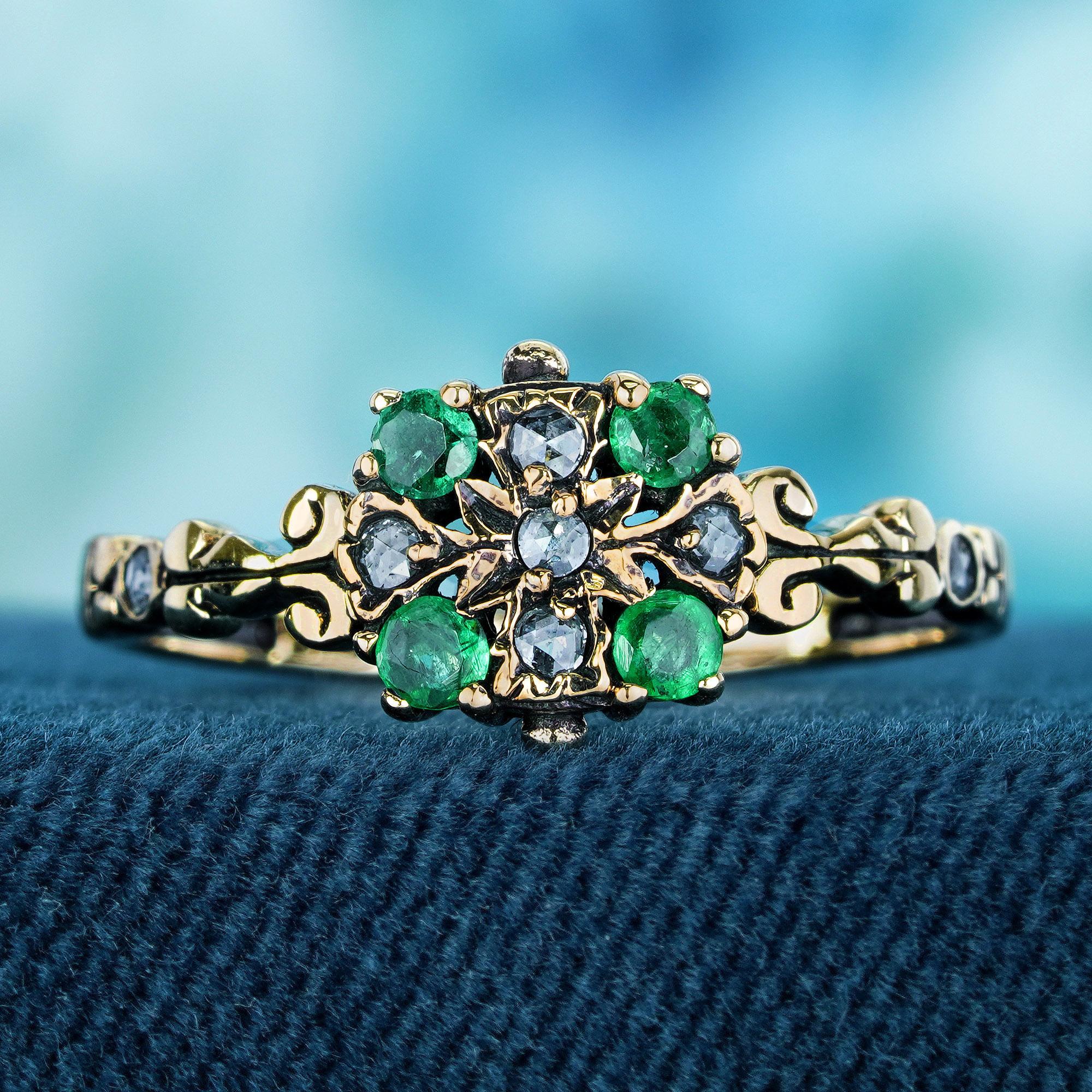 Behold the allure of this yellow gold vintage-style floral ring, adorned with round natural emeralds and diamonds, a testament to exquisite and timeless elegance. The delicate yellow gold band, intricately designed with floral motifs, promises to