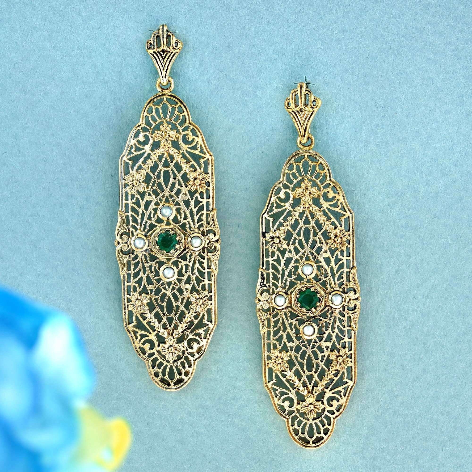 Indulge in the enchanting fusion of green, white, and gold as you revel in these captivating vintage-style filigree leaf-inspired earrings. The enduring allure of the green round emerald, accompanied by round white pearls in four directions within a
