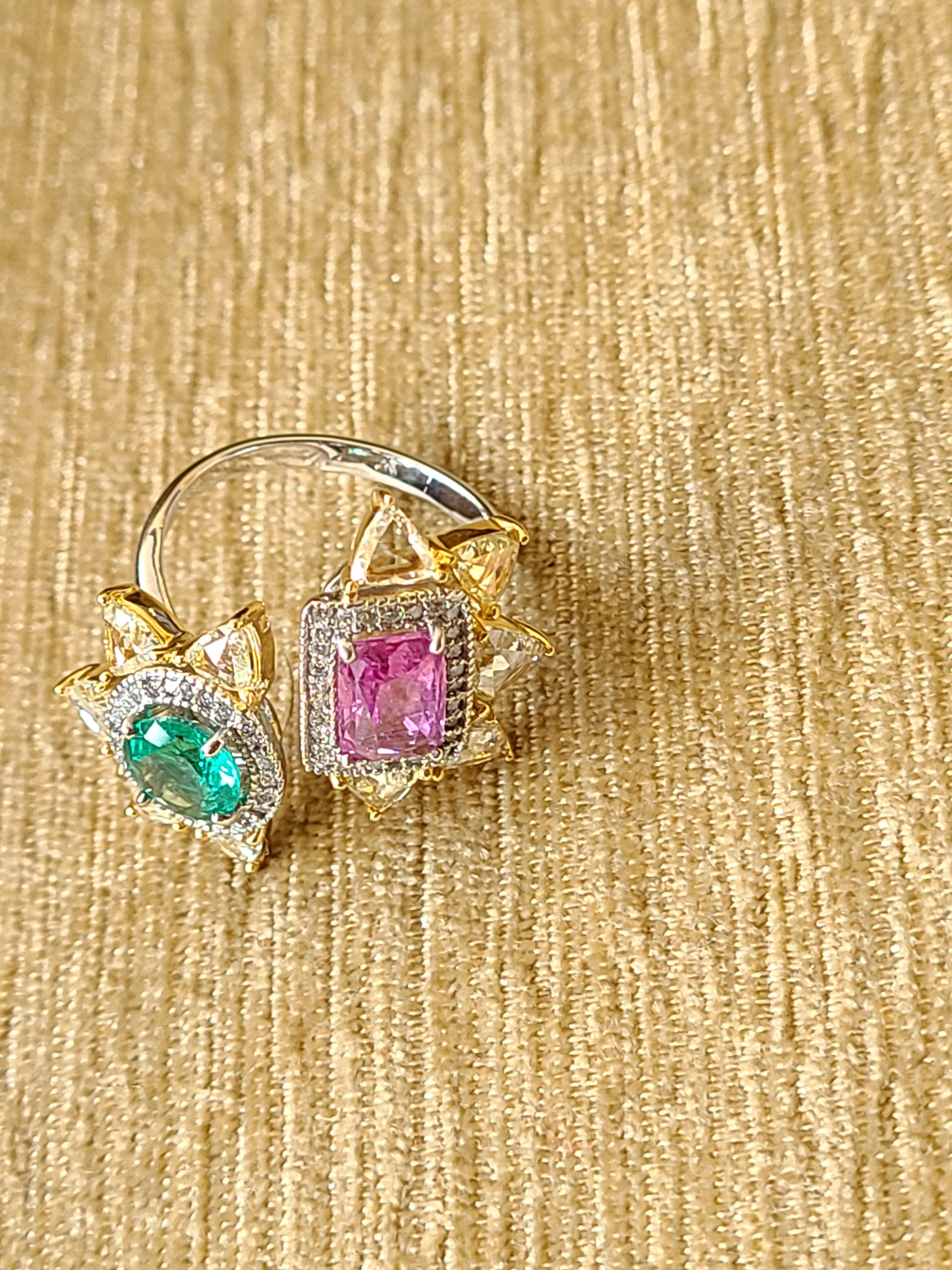A gorgeous and chic emerald and pink sapphire ring set in 18k white and yellow gold with rose-cut diamond. The emerald weight is .86 carats and pink sapphire weight is 1.54 carats, the diamond combined weight is 1.78 carats. The net gold weight is