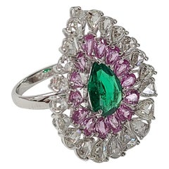 Natural Emerald and Pink Sapphire Ring with Diamonds Set in 18 Karat Gold