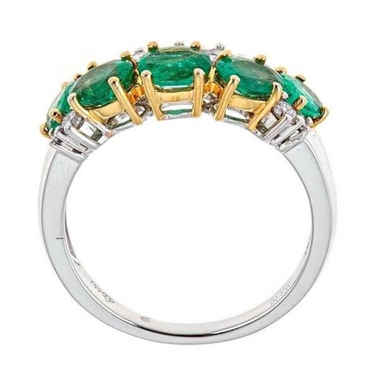 Natural Emerald and Round Diamond Band Ring 18 Karat White Gold Fine Jewelry

An adorable ring she will not take off. Polished to a brilliant shine, this ring is crafted in beautiful two-tone gold. Astonishing five natural emeralds of oval cut are