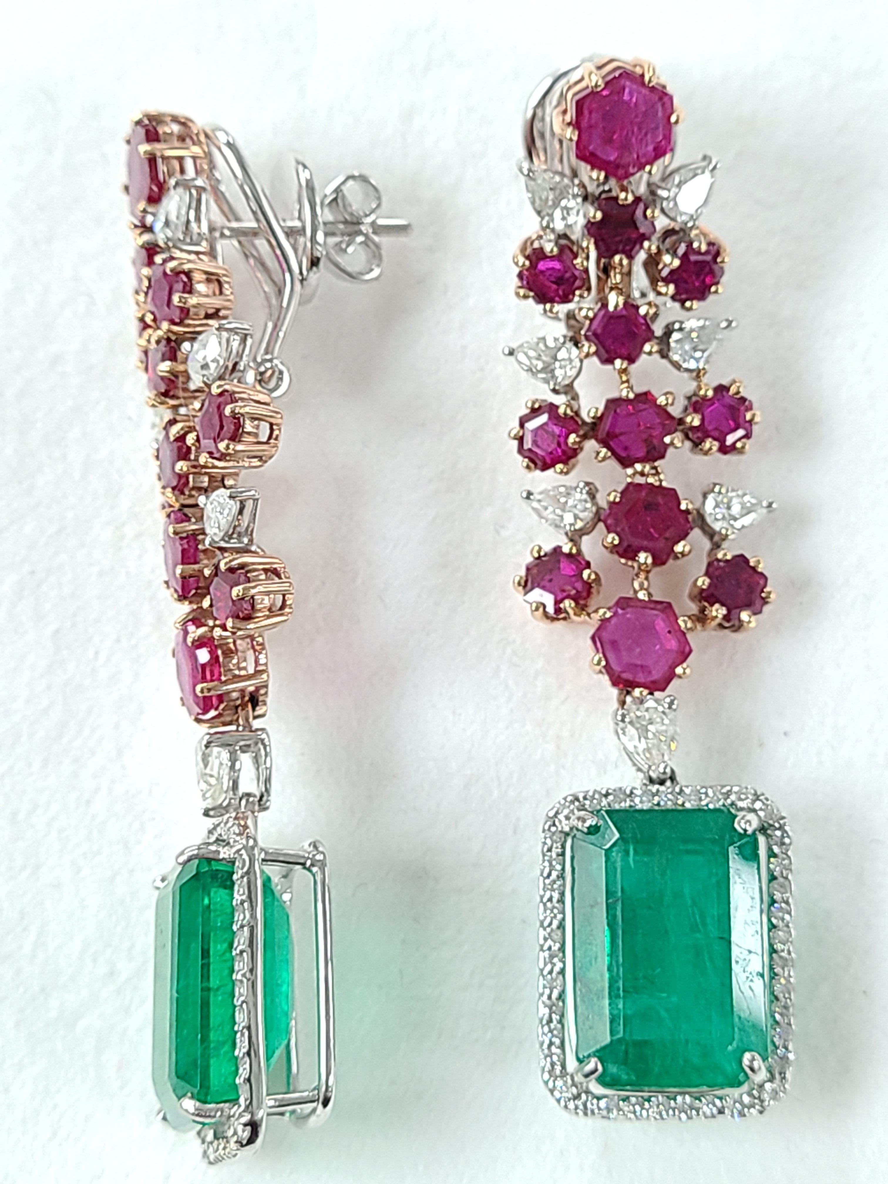 A beautiful and Party wear cocktail earrings set in 18k gold with Natural Zambian emeralds and No heat ruby from Mozambique . The emerald weight is 17.18 carats and ruby weight is 6.18 carats . diamond weight is 2.06 carats. The length of the