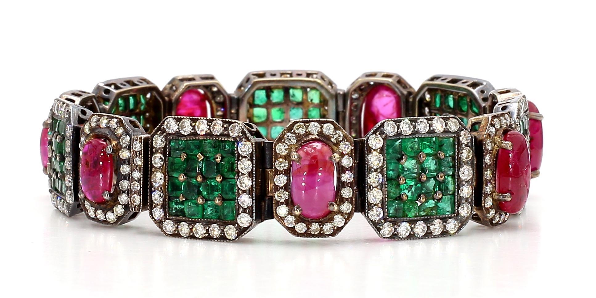 The Emerald Ruby and Diamond Deco Style Bracelet is a stunning piece of jewelry that exudes elegance and sophistication. Crafted with utmost precision and attention to detail, this bracelet showcases a harmonious combination of emeralds, rubies, and