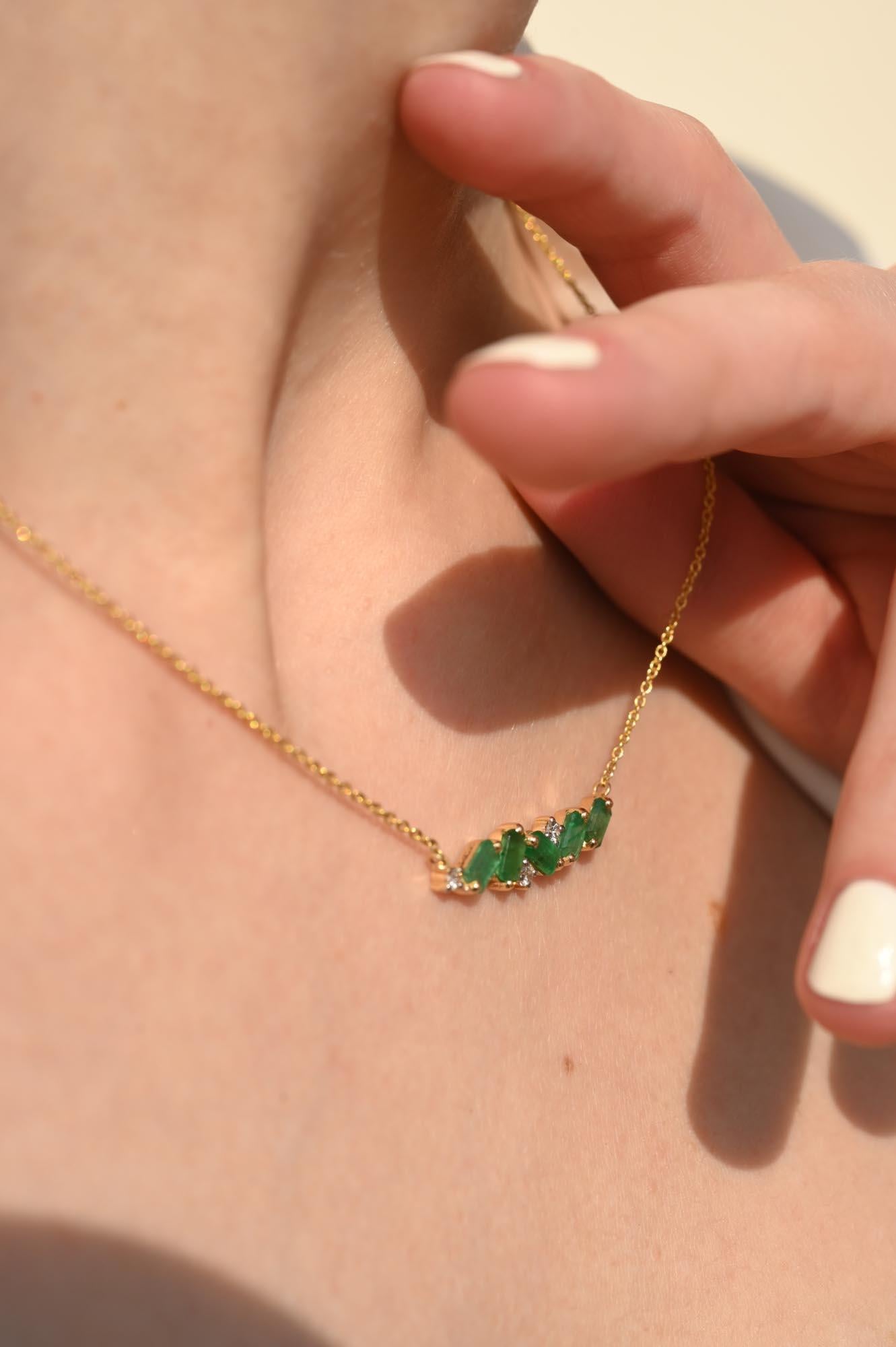 Emerald Bar Pendant Necklace with Diamonds in 14K Gold studded with octagon cut emerald and round cut diamonds. This stunning piece of jewelry instantly elevates a casual look or dressy outfit. 
Emerald enhances intellectual capacity of the
