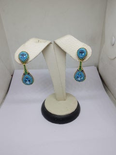 Orecchino con diamante naturale e smeraldo topazio blu in oro 18 carati