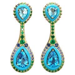 Orecchino con diamante naturale e smeraldo topazio blu in oro 18 carati