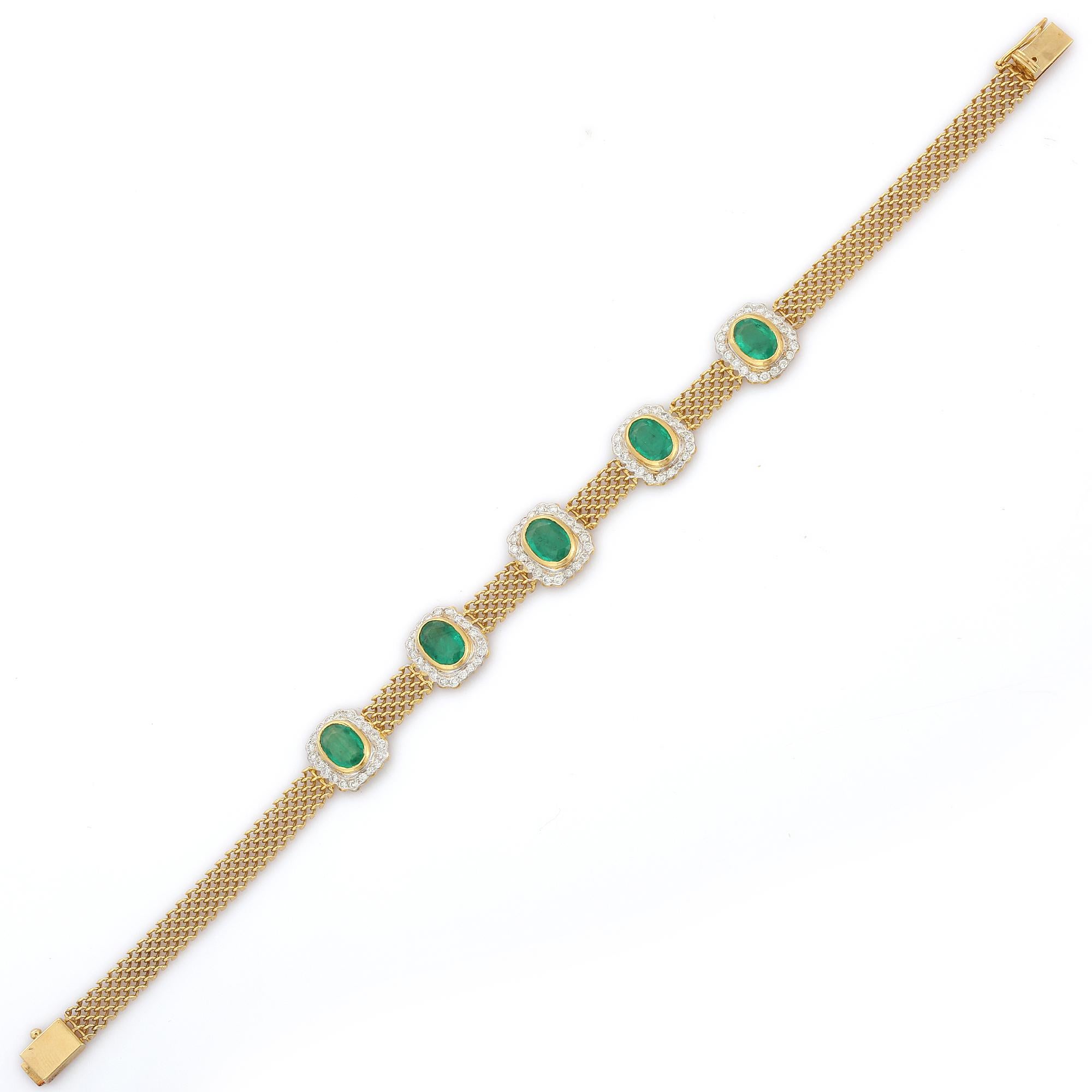 Oval Cut Natural Emerald Cuff Bracelet in 18K Yellow Gold with Halo of Diamonds    For Sale