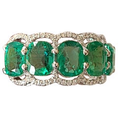 Natural Emerald Cushion Ring Set in 18 Karat Gold with Diamonds