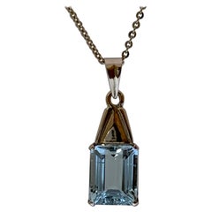 Natural Emerald Cut Aquamarine Pendant Set in 14 Karat Gold