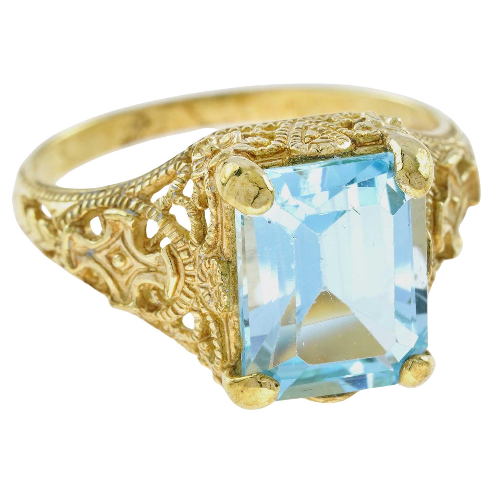 For Sale:  Natural Emerald Cut Blue Topaz Vintage Style Filigree Ring in Solid 9K Gold