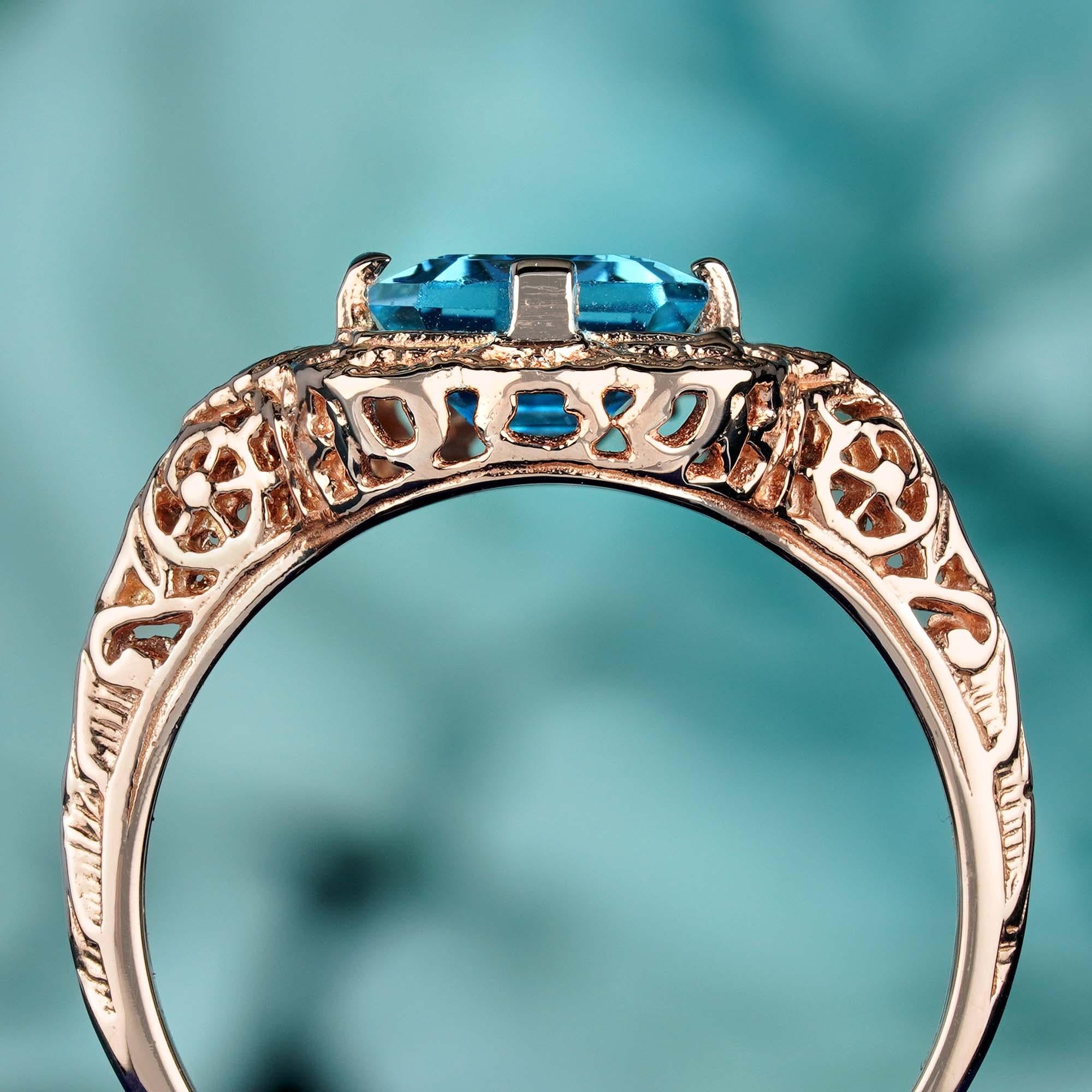 Filigraner Ring aus massivem 9 Karat Roségold mit natürlichem blauem Topas im Smaragdschliff im Vintage-Stil Damen im Angebot
