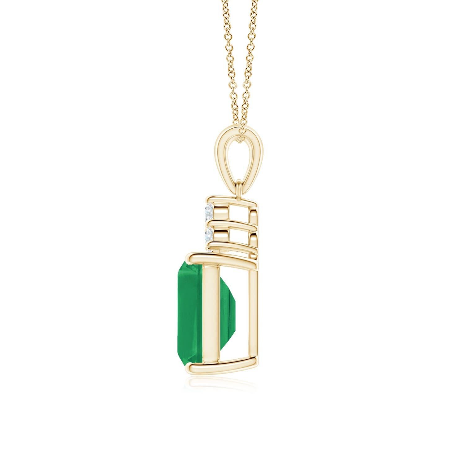 A stunning emerald-cut emerald sits pretty in a four-prong setting, topped by a glimmering cluster of diamonds. The rich green gemstone is enhanced by the brilliance of the sparkling white diamonds. This exquisite emerald dangle pendant is an