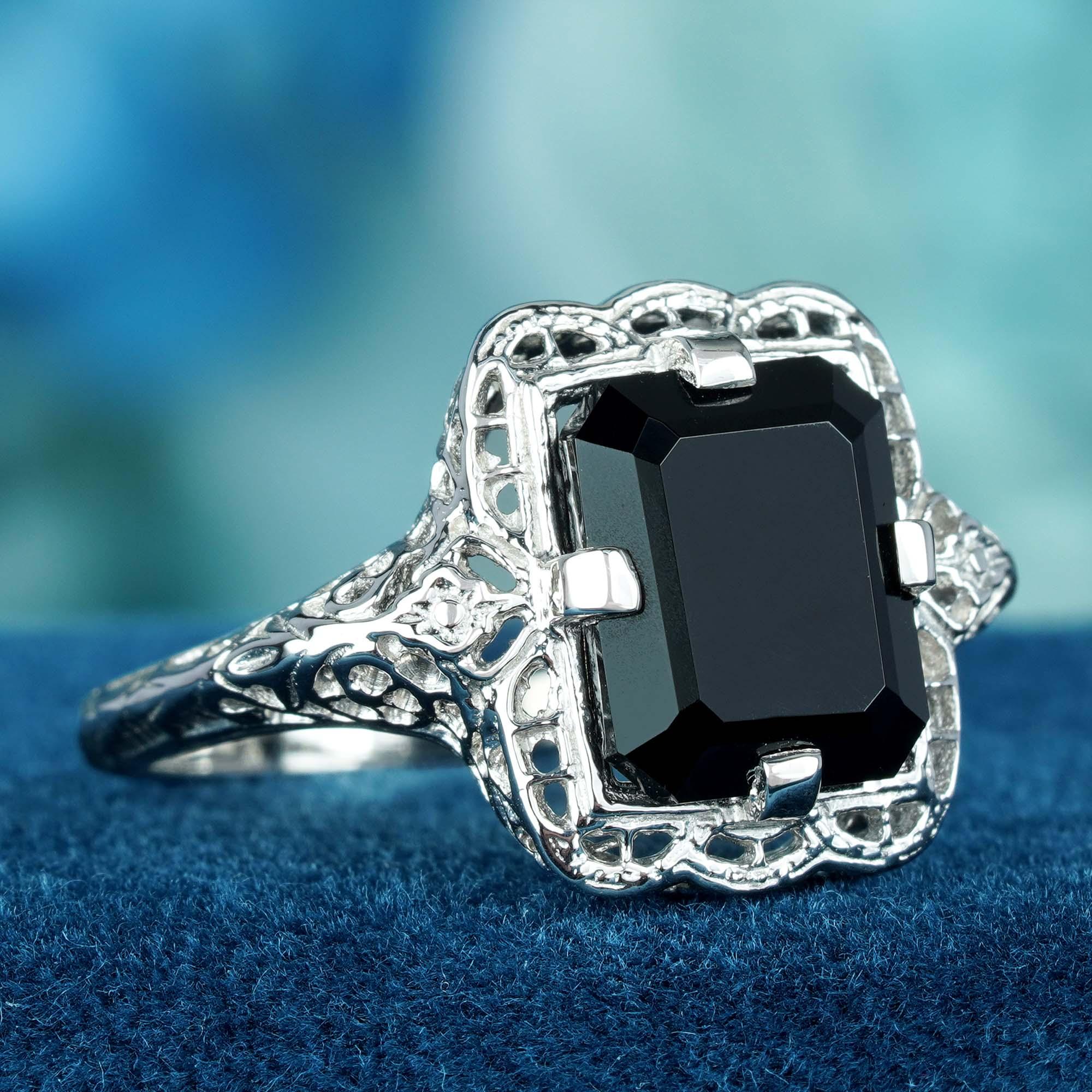 Experience the allure of a bygone era with this timeless piece, meticulously crafted from solid white gold. Adorned with a captivating 3.5-carat natural onyx gemstone in a prong setting, the onyx exudes an enigmatic depth reminiscent of moonlit