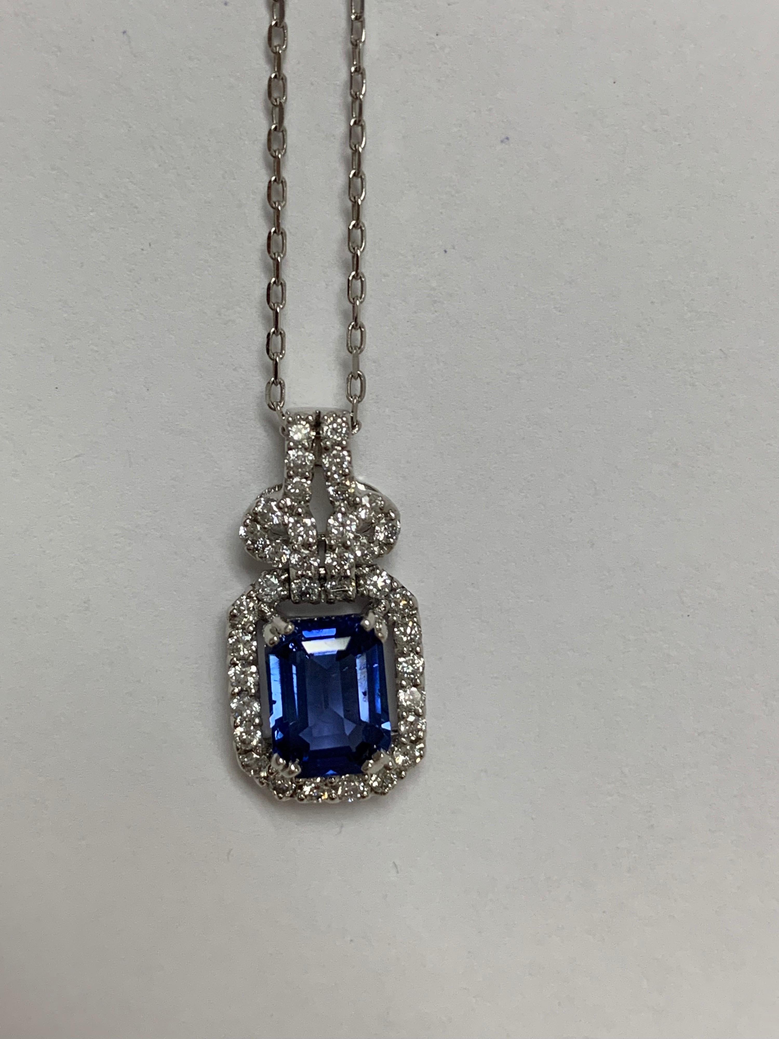 Natural 1.80 Carat blue sapphire and 0.49 Carat round white diamond set in 18 Karat white gold is one of a kind handcrafted pendant, The pendant include 18 Inches white gold chain.