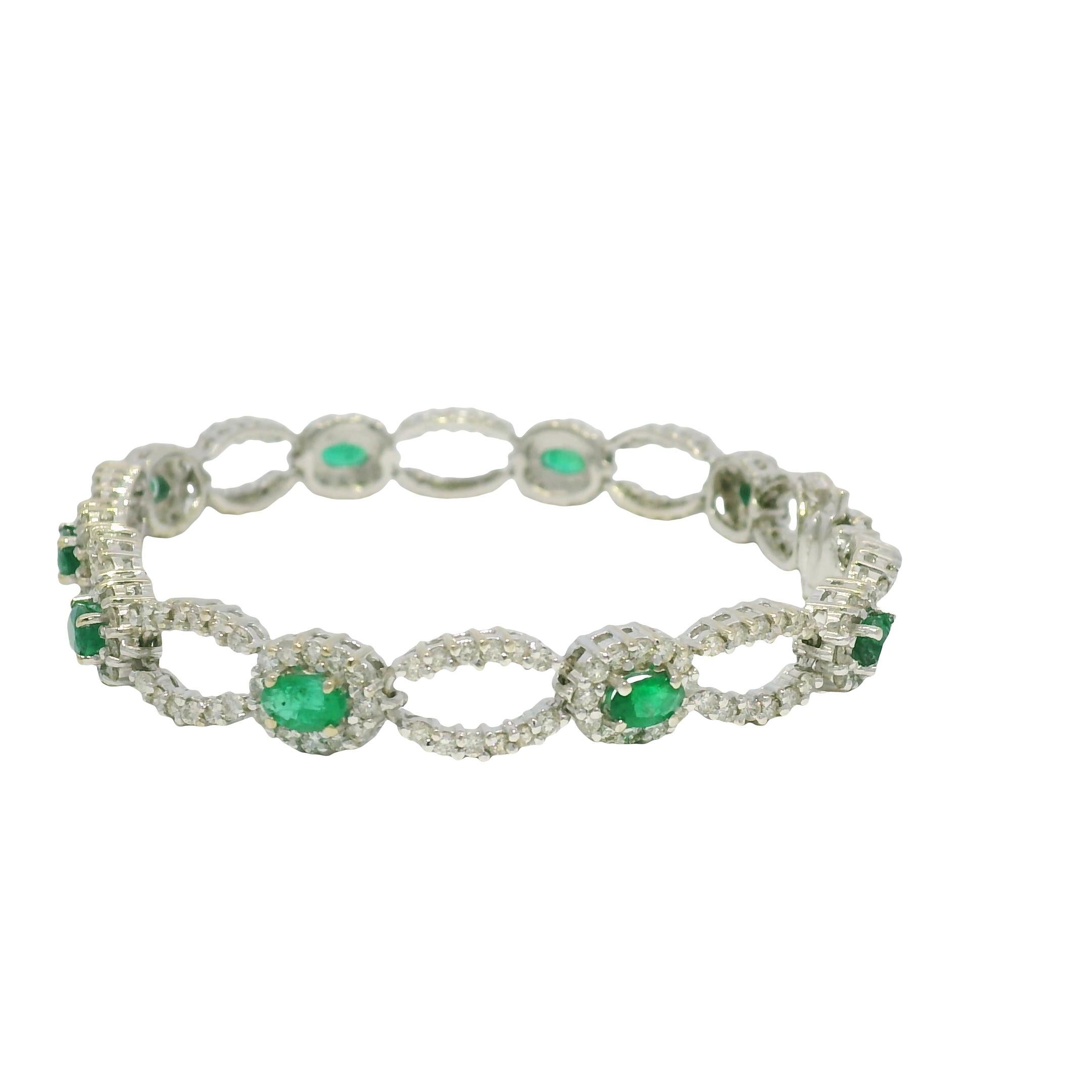 14k White Gold Natural Emerald & Diamond Open Link Bracelet

Material: 14k White Gold
Diamond Details: There are approximately 3 carats of natural, round brilliant-cut diamonds
Diamond Clarity: All diamonds are approximately VS/SI (Very Slightly to