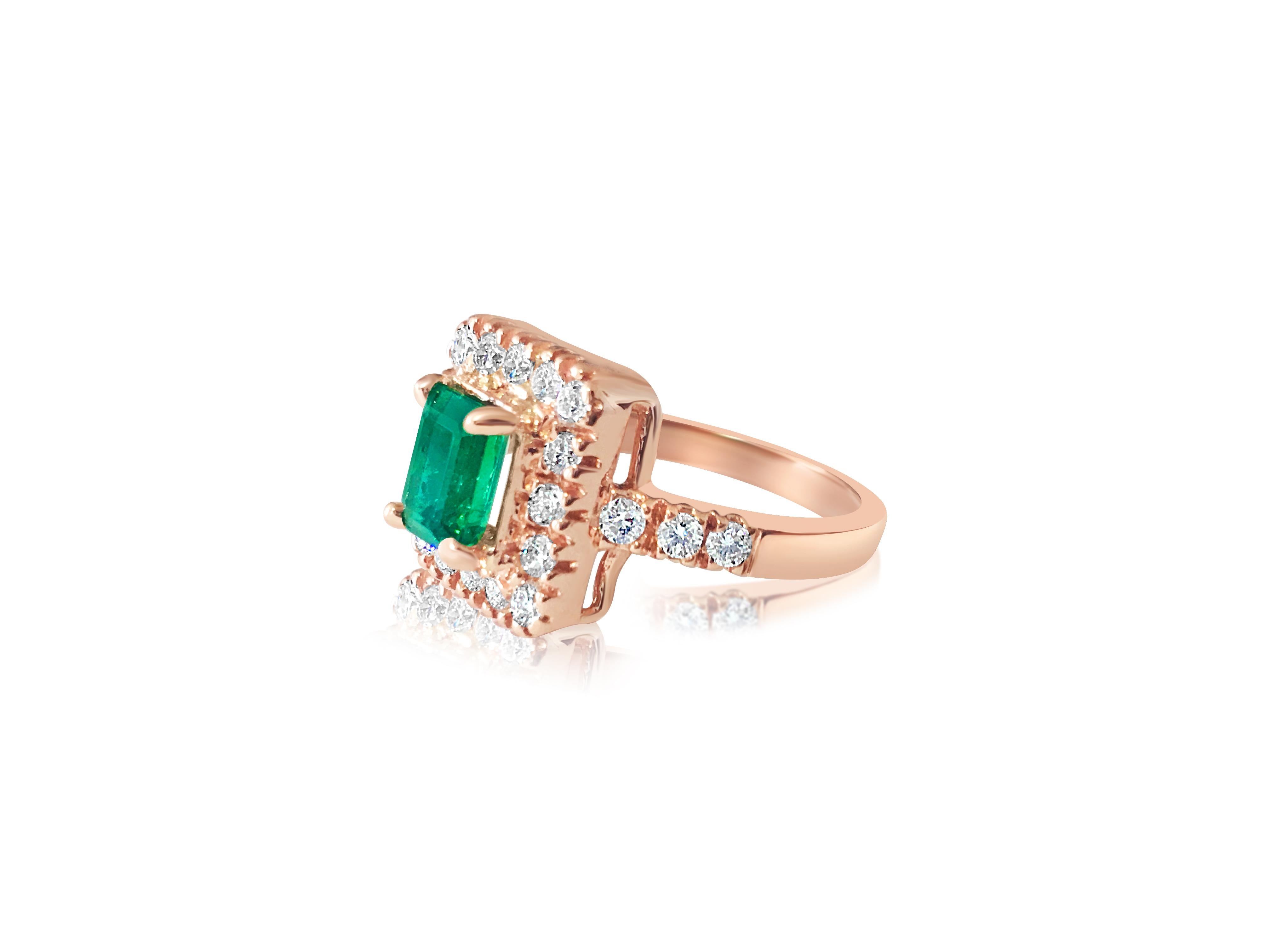 Metal: 14K Rose Gold.
1.00 carat emerald. Cut: Emerald. Prong setting. 100% natural earth mined emerald. 
Side diamonds: 0.788 carats total, VS clarity and G color. Round brilliant cut diamonds set in prongs. 100% natural earth mined diamonds.