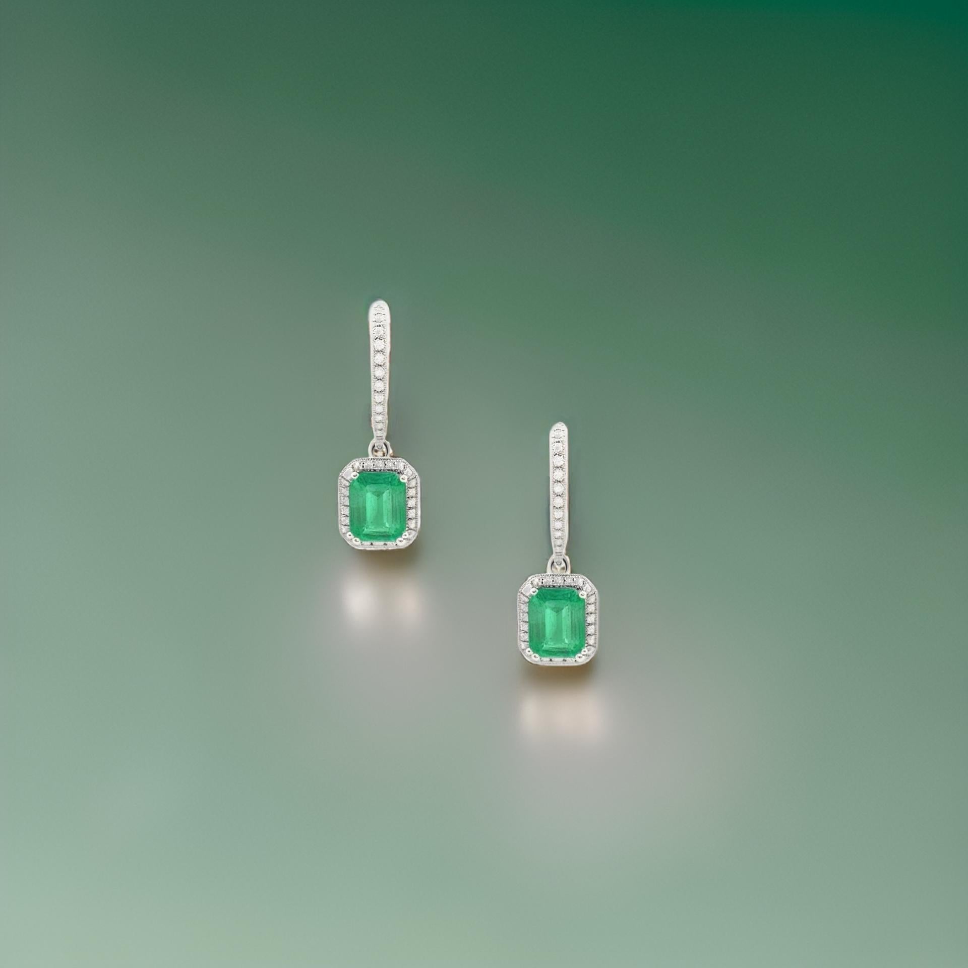 Natural Finely Faceted Quality Emerald and Diamond Dangle Earrings set in 14k White Gold with 3.06 TCW Certified $5,950 211183

These luxurious, one-of-a-kind natural emerald and diamond drop earrings feature a sophisticated design that exudes