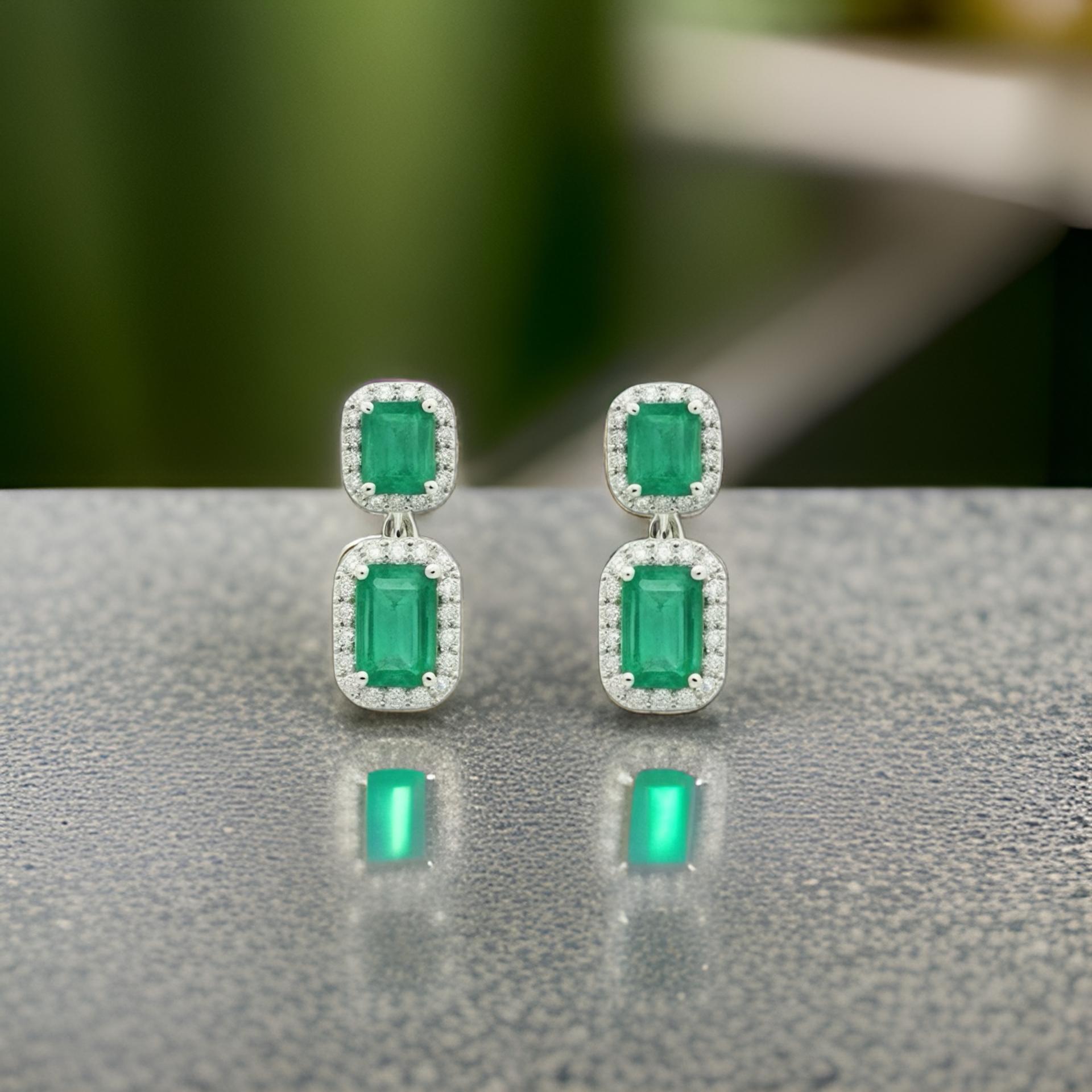 Natural Finely Faceted Quality Emerald and Diamond Earrings set in 14k white Gold with 3.48 TCW

Certified $7,950 310551

This is a Unique Custom Made Glamorous Piece of Jewelry!These stunning earrings feature natural, finely faceted emeralds paired