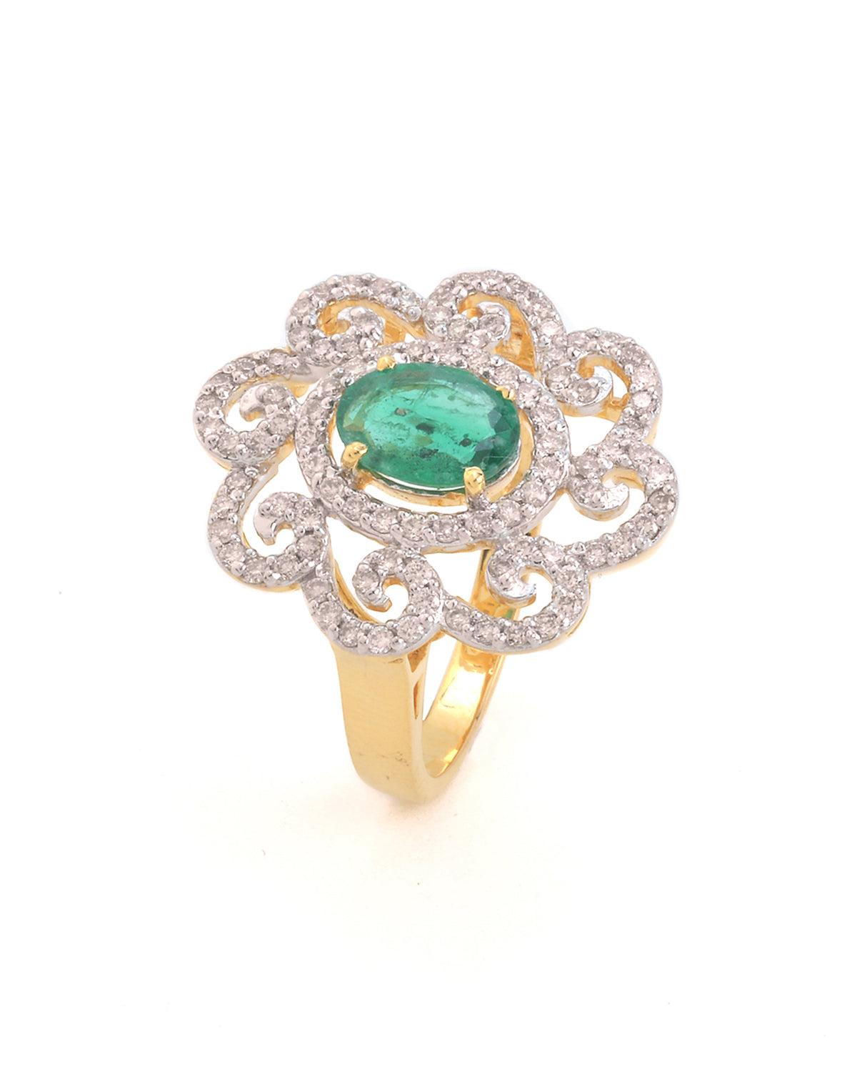 This floral ring is made of 18K yellow gold and features an emerald stone. It is handmade and is a beautiful addition to any jewelry collection. Embrace your love for this 18k yellow gold handmade ring. The design is so unique stylish. It would be