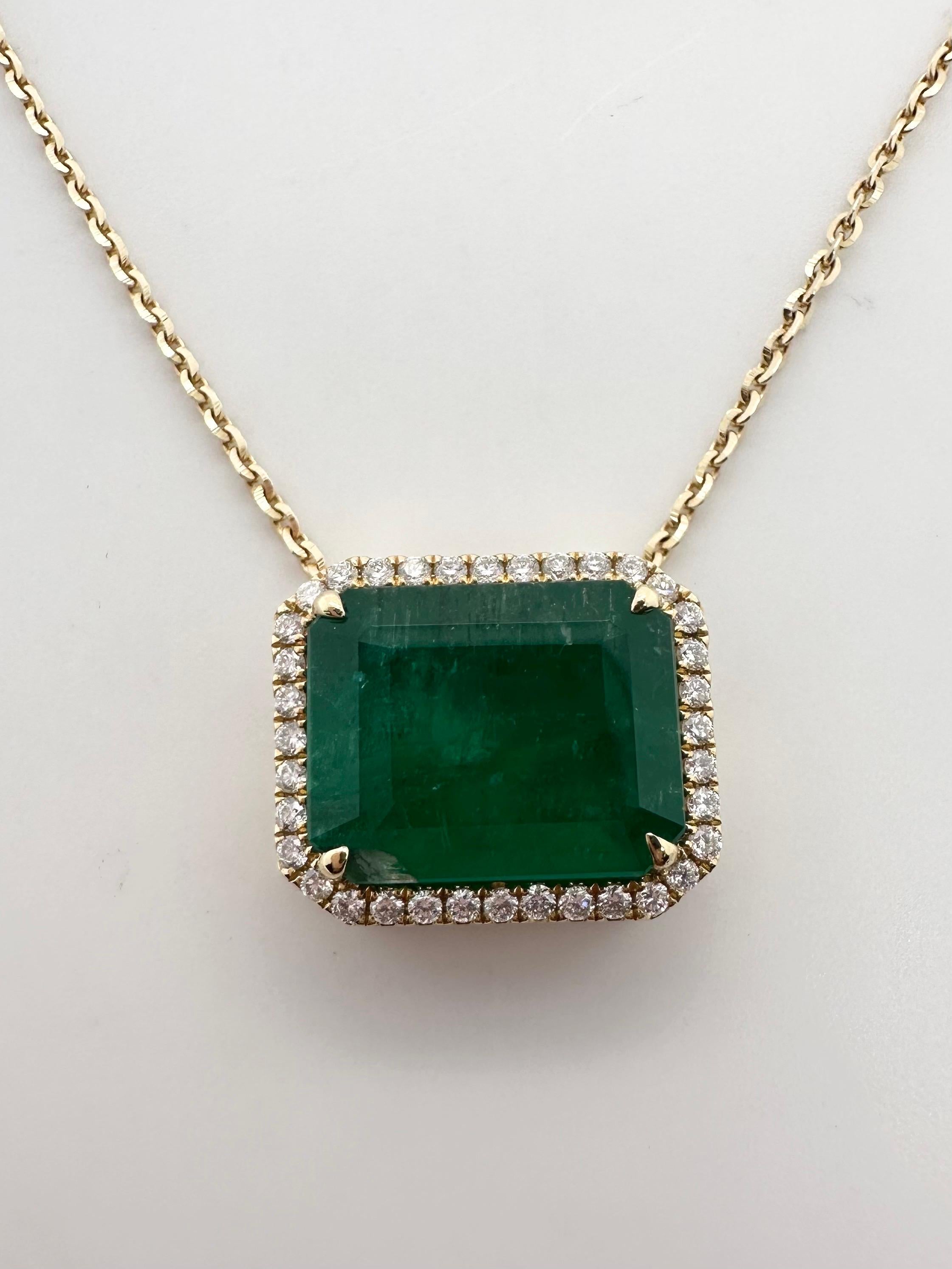 Modern emerald diamond pendant in 18Kt gold, the emerald weight 7.36 carats, green color with moderate inclusions. The diamonds weigh 0.33ct and are VS clarity and G color. Certificate for the emerald from AIG is available as well as the certificate