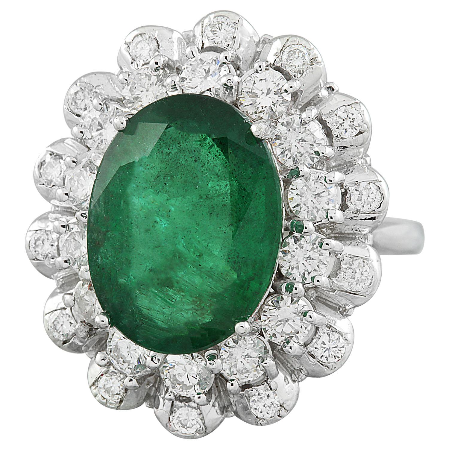 8.20 Carat Natural Emerald 14 Karat Solid White Gold Diamond Ring
Stamped: 14K 
Total Ring Weight: 7.9 Grams 
Emerald Weight 6.88 Carat (14.00x10.00 Millimeters)
Diamond Weight: 1.32 Carat (F-G Color, VS2-SI1 Clarity )
Face Measures: 23.40x19.75