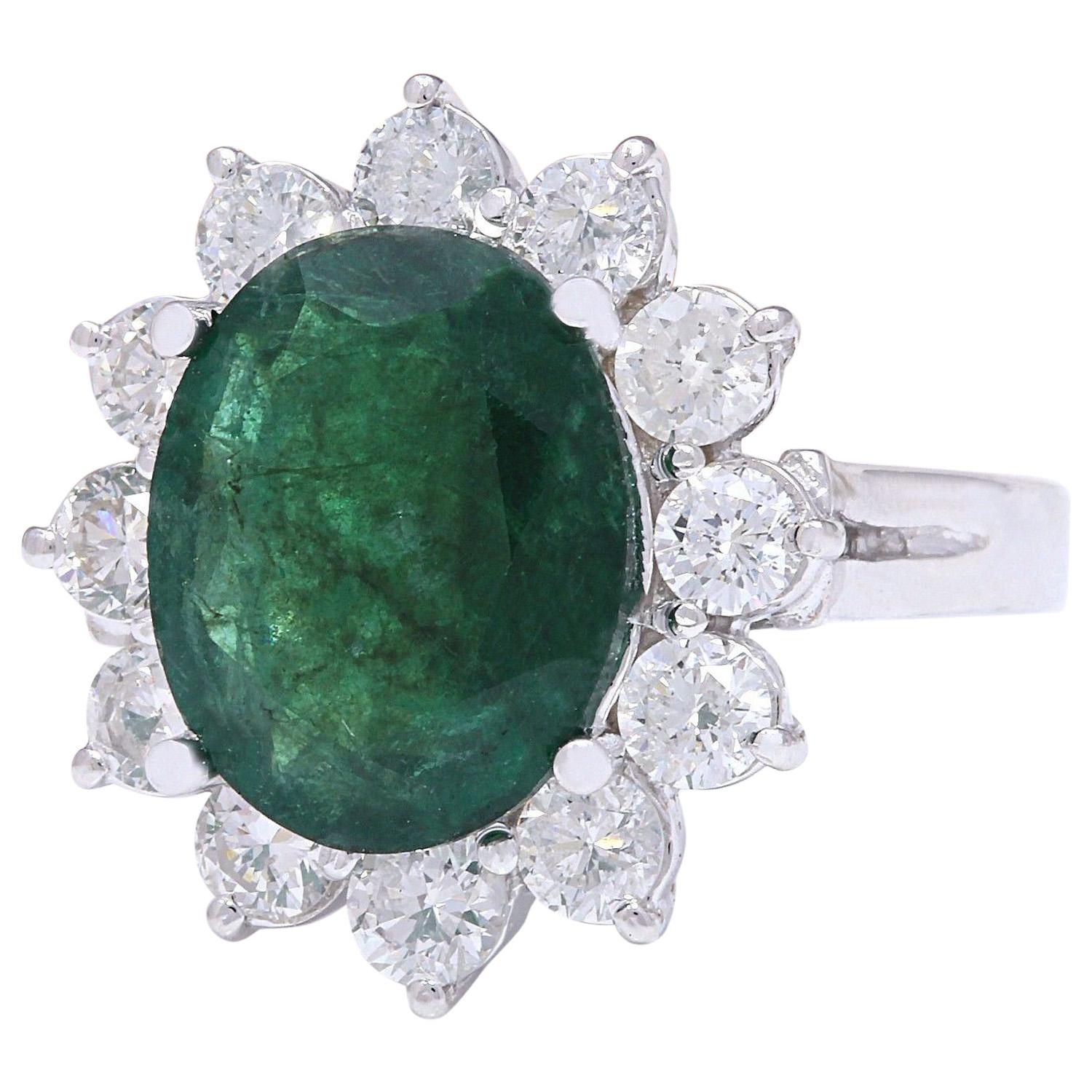 Crafted with elegance, this exquisite ring features a 4.68 carat natural emerald set in lustrous 14K white gold. The captivating oval-shaped emerald, weighing 3.48 carats and measuring 11.00x9.00 mm, commands attention with its rich green hue.