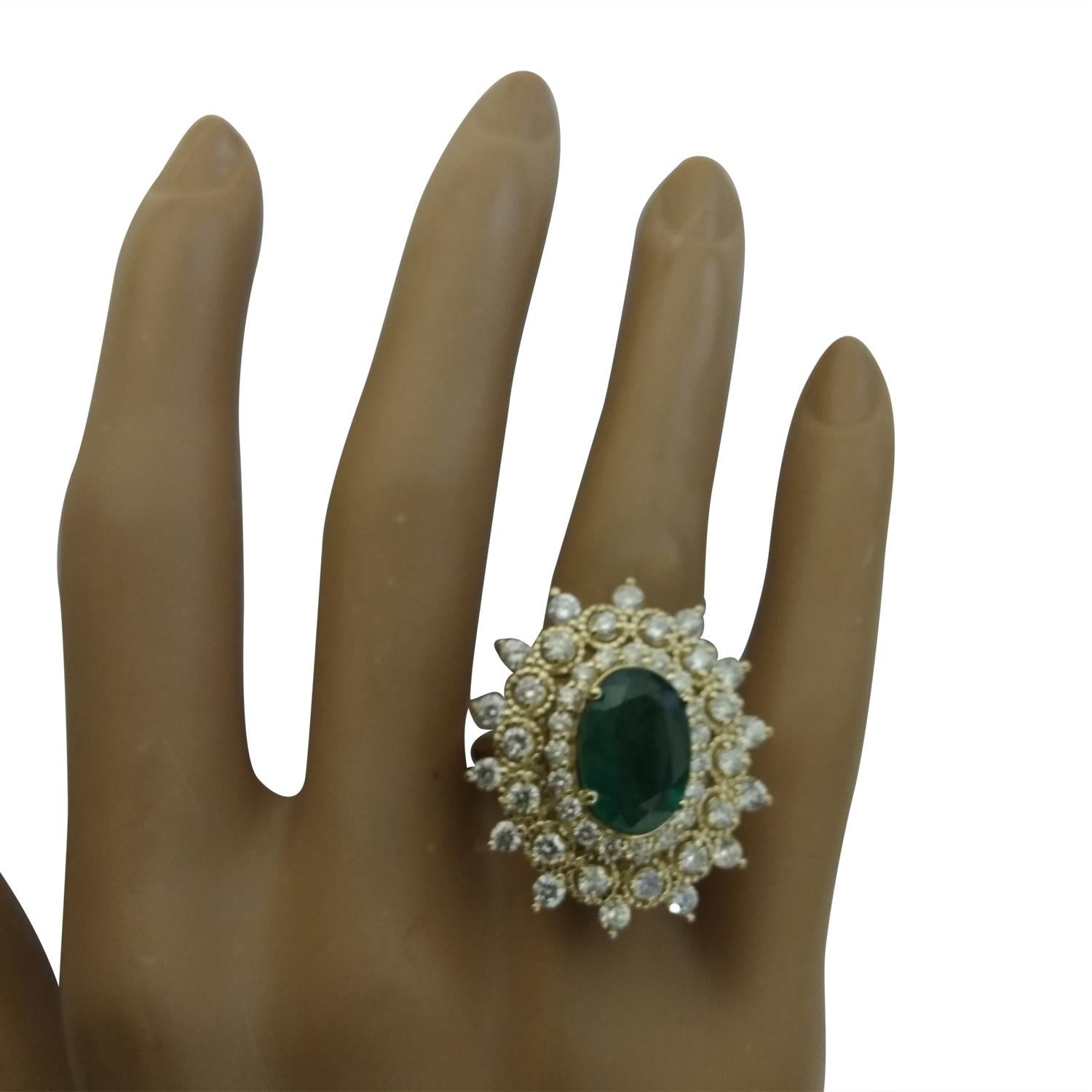7.15 Carat Natural Emerald 14 Karat Solid Yellow Gold Diamond Ring
Stamped: 14K 
Ring Size 7
Total Ring Weight: 9.2 Grams 
Emerald Weight 5.30 Carat (12.00x10.00 Millimeters)
Natural Emerald Treatment: Oil Only
Diamond Weight: 1.85 Carat (F-G Color,