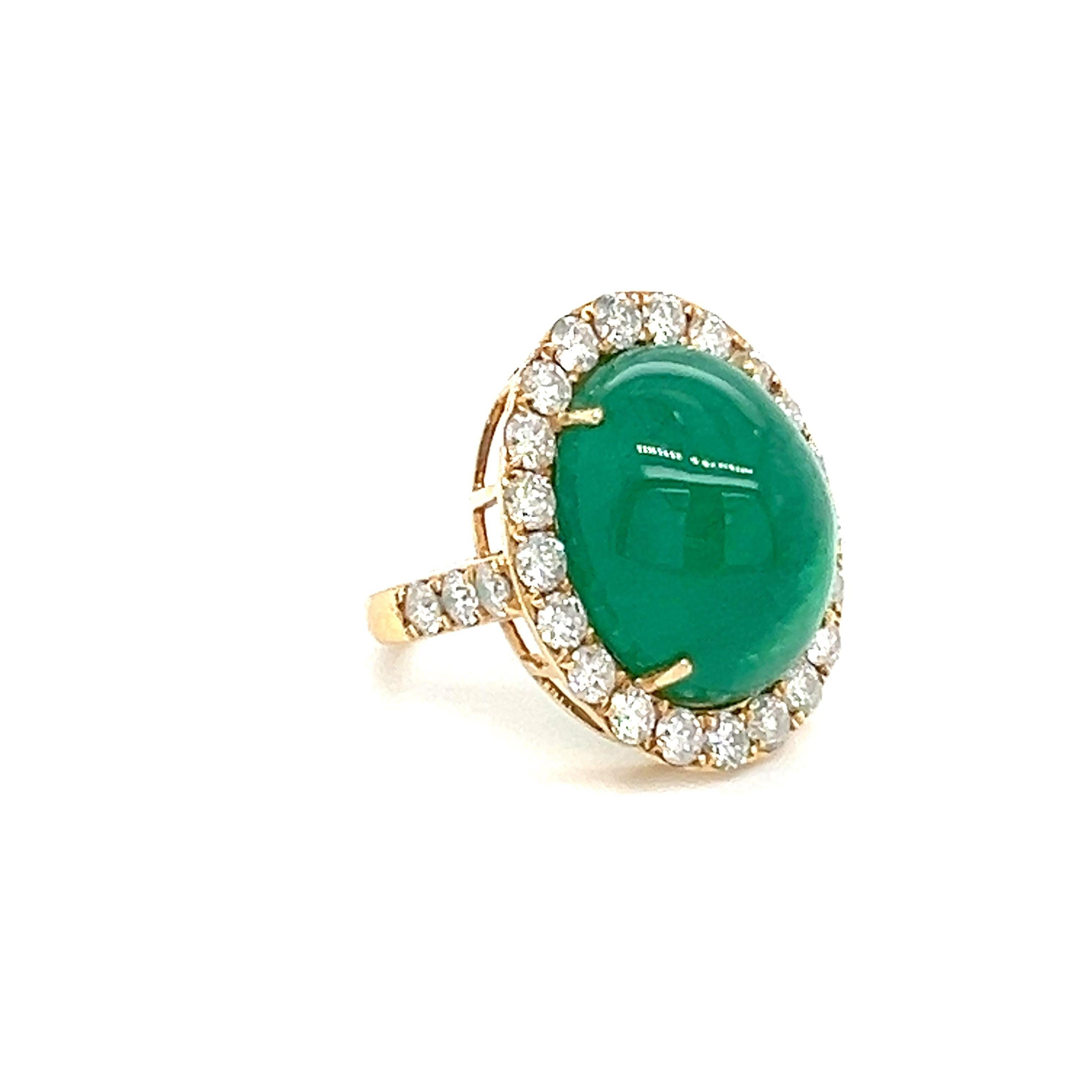A stunning Natural Emerald Diamond ring set in 18-Kt yellow gold ring featuring with natural 18.99-carat emerald beautifully surrounded by 2.30-carat natural diamonds. 