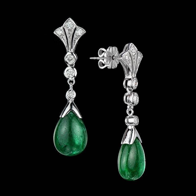 Natural Emerald from Zambia, Intense Green color all over the pieces as a set of Pendant and Earrings.  

The pendant was made as an enhancer to clip on any choker or pearl strand necklace.  Only the pendant, Emerald was weighed 8.62 Carat set with