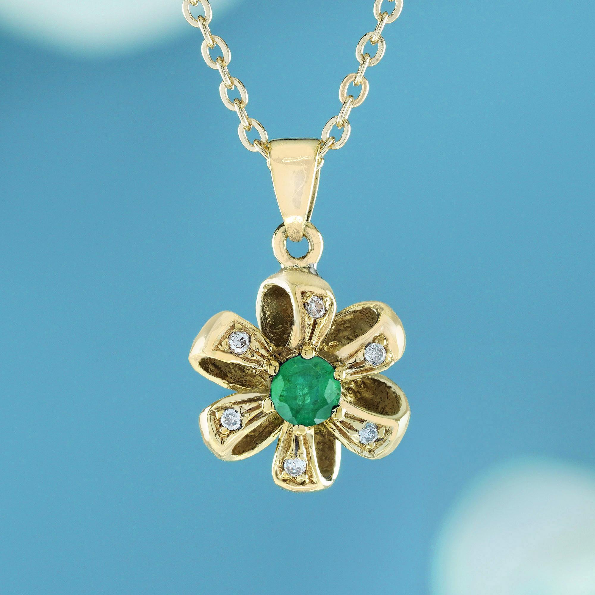 Crafted from solid yellow gold, this pendant captures the essence of a blooming flower in exquisite details. At its center lies a dazzling green emerald pollen, securely nestled amidst the petals in a prong setting The petals themselves are formed