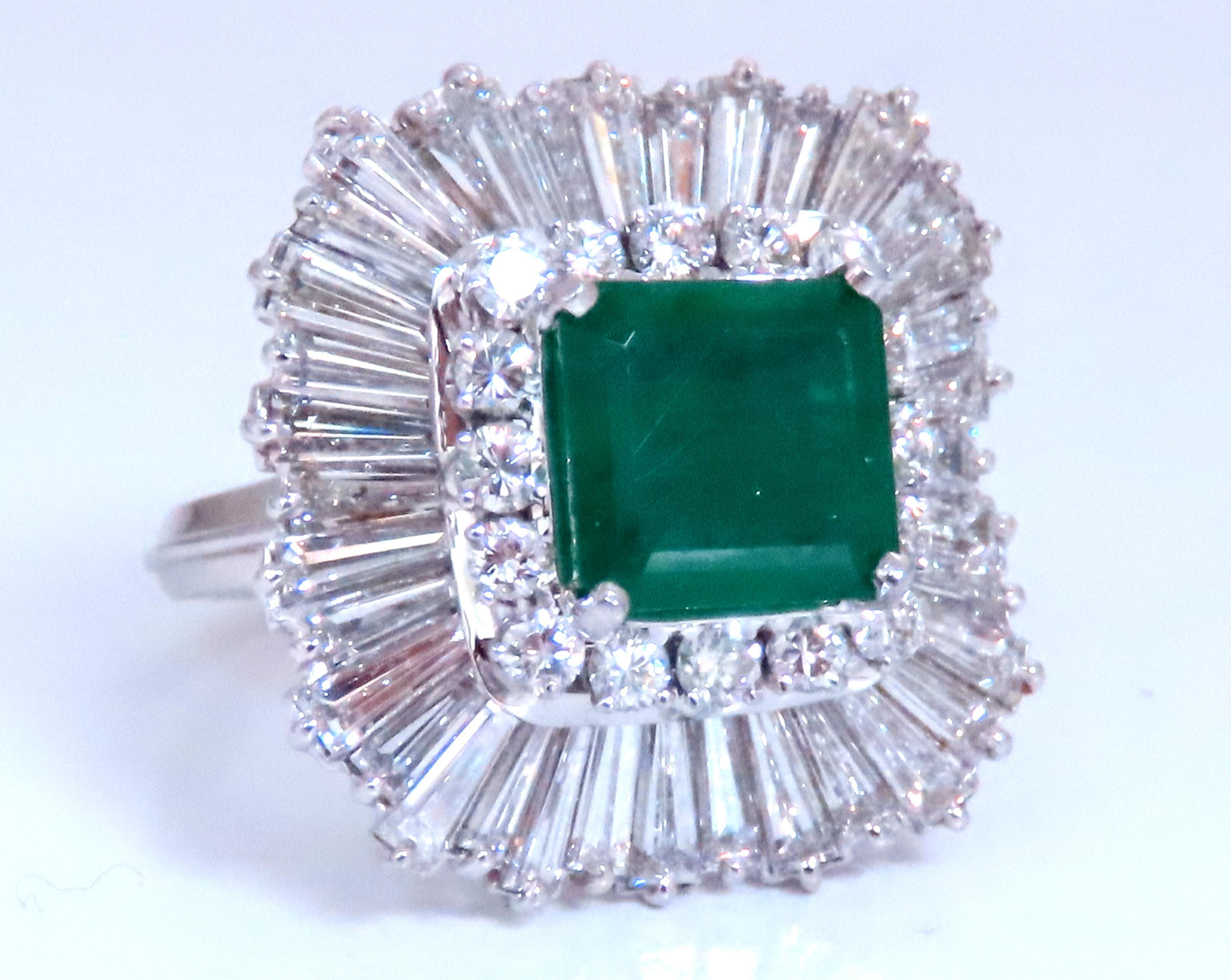 Natural Diamonds Ballerina Cocktail Cluster Ring
3.50ct Natural Emerald
Emerald cut, 8.6 x 8.4mm
Transparent
4ct Diamonds, Baguette & Rounds
G-H-I color Vs-2 S-1 clarity
Platinum
12.9 grams
21 x 21mm deck
13.3mm depth
Size 6.5
$20,000 Appraisal to