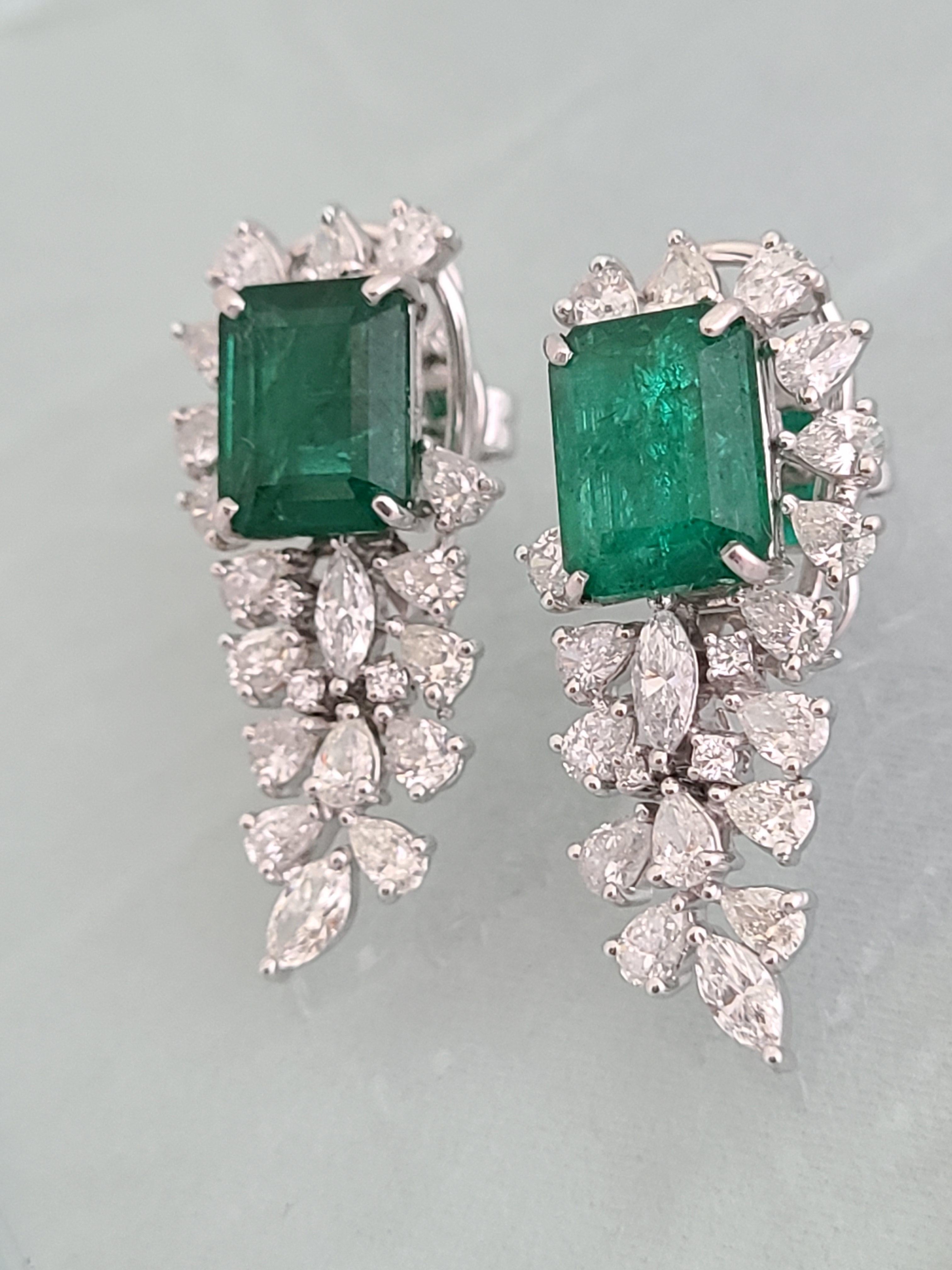 A gorgeous and chic Emerald earrings in 18k white gold with fancy cut natural diamonds. The emerald pair weight is 8.5 carats and is completely natural , diamond combined weight is 4.10 carats. The earrings dimensions in cm 3.3 x 1.5 x 2 (LXWXD).