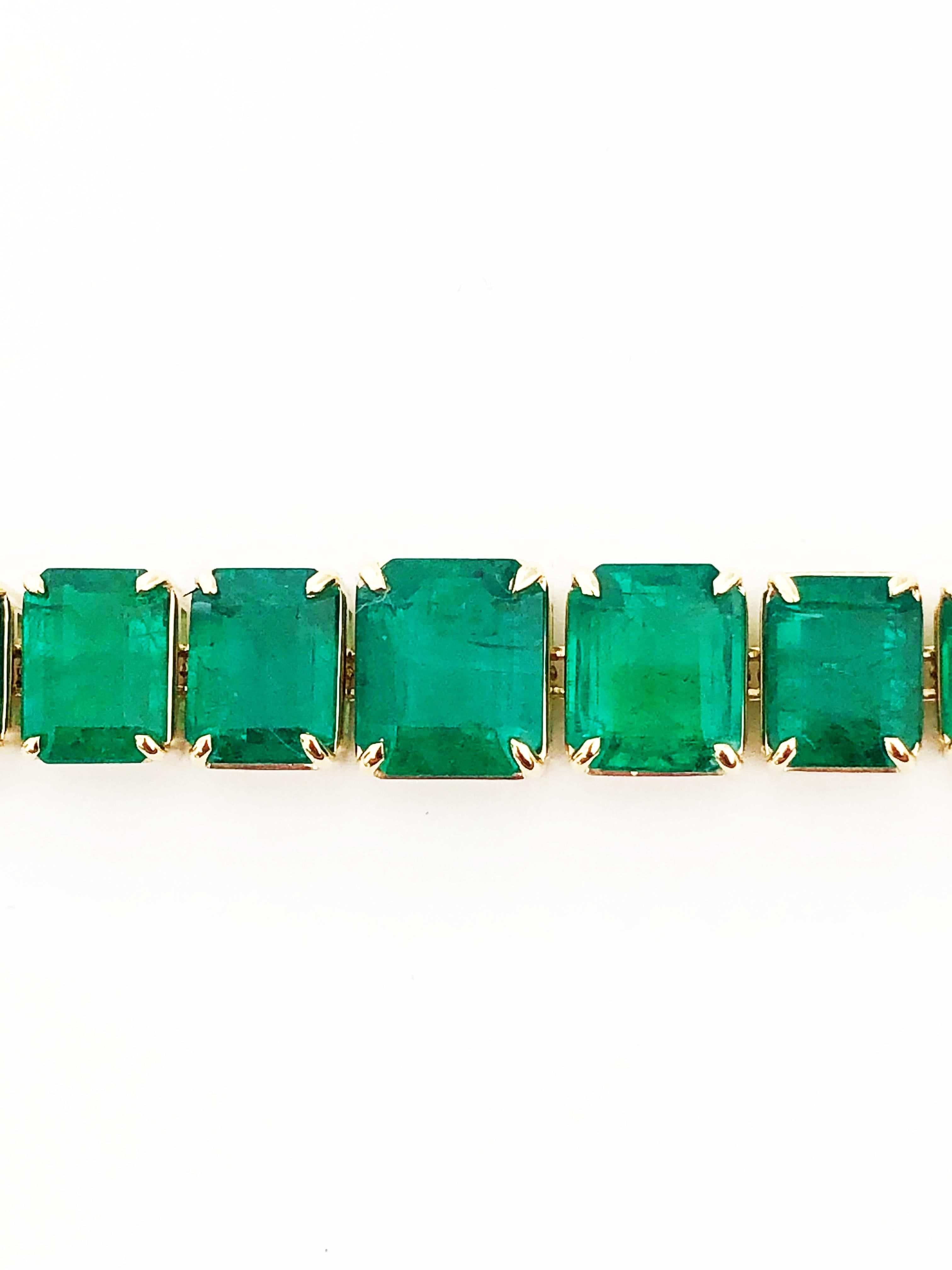 Breathtaking natural emerald bracelet showcases 48.12 cts of emerald cut stones in a handcrafted 18k yellow gold mounting.  17 total stones that are the perfect green.  Such a unique design with no diamonds.  Flexible and dainty.  Currently 6