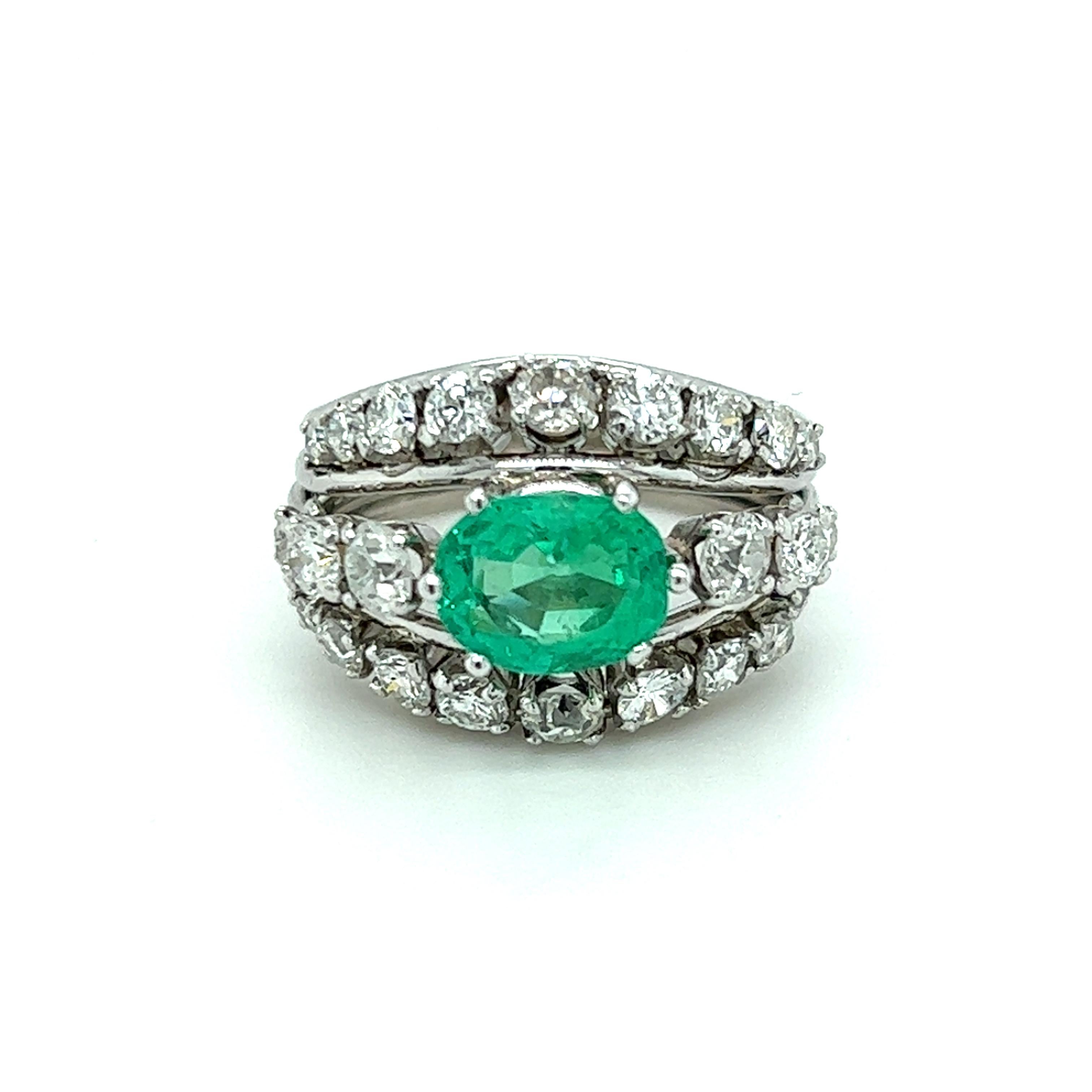 One beautifully constructed platinum wire construction dome ring set with one 8x6mm oval fine natural emerald, approximately 1.05 carat, and twenty-four (24) European cut diamonds, approximately 1.50 carat total weight with matching H/I color and