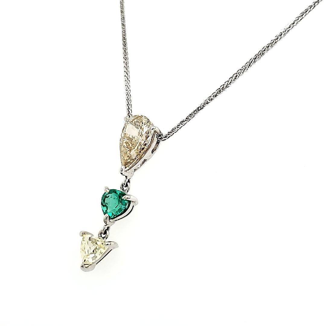 Imagine adorning your neck with a cascade of sparkling diamonds and a radiant emerald heart—a symphony of precious gemstones that embodies elegance and sophistication. 

At its core lies a dazzling Diamond Pear weighing 1.58 carats, accentuating the