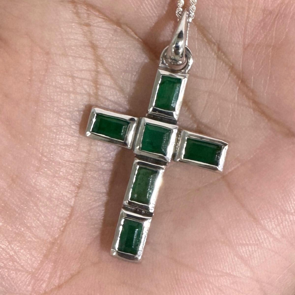 Natural Emerald Jesus Cross Pendant in sterling silver studded with baguette, square cut emerald. This stunning piece of jewelry instantly elevates a casual look or dressy outfit. 
Emerald enhances the intellectual capacity of the person.
Designed