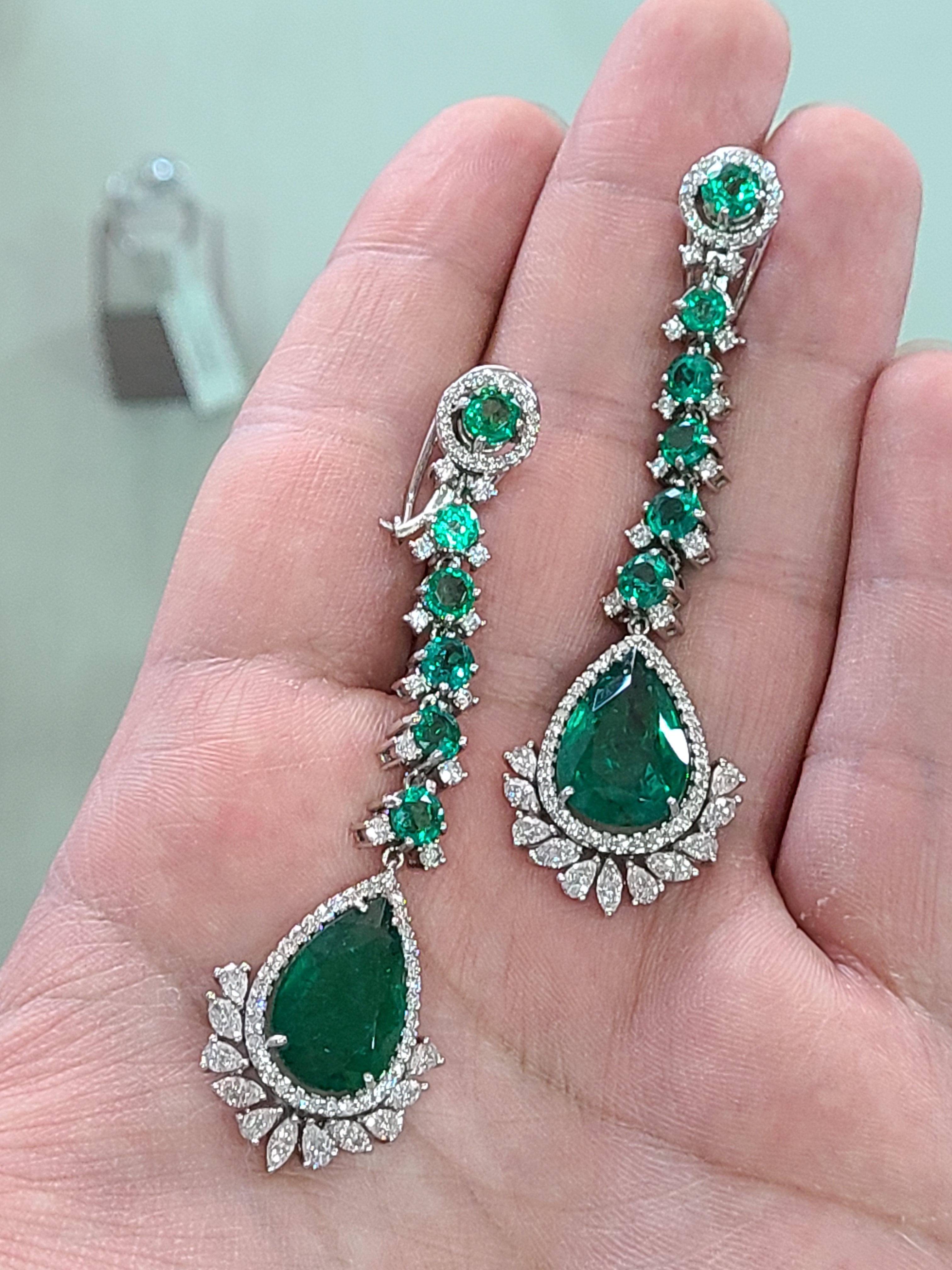 Modern Natural Emerald Long Earrings Set in 18 Karat Gold with Diamonds
