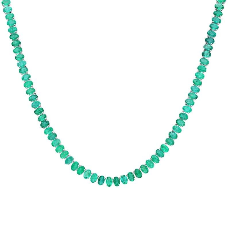 PRODUCT DETAILS -

===============

GEMSTONE DETAILS :

Gemstone : Emerald

Gemstone Weight : 39.36 cts

Gemstone Size : 6X4 mm

Gemstone Shape : Oval

Gemstone Type : Natural



METAL DETAILS :

Metal Purity : Solid 18K Gold

Metal Color : White
