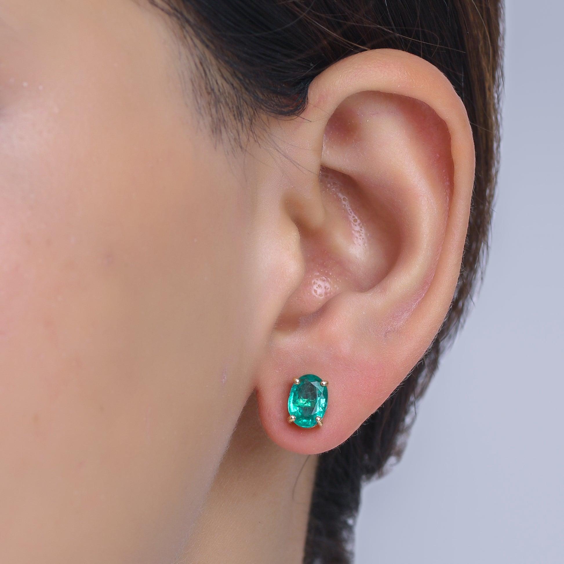 Contemporary Natural Emerald Oval Prong Set Earrings For Sale