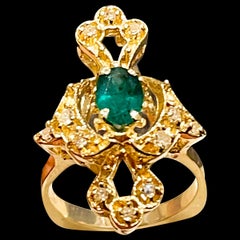 Natural Emerald, Oval Stone and Diamond Ring 14 Karat Yellow Gold