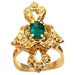 Natural Emerald, Oval Stone and Diamond Ring 14 Karat Yellow Gold